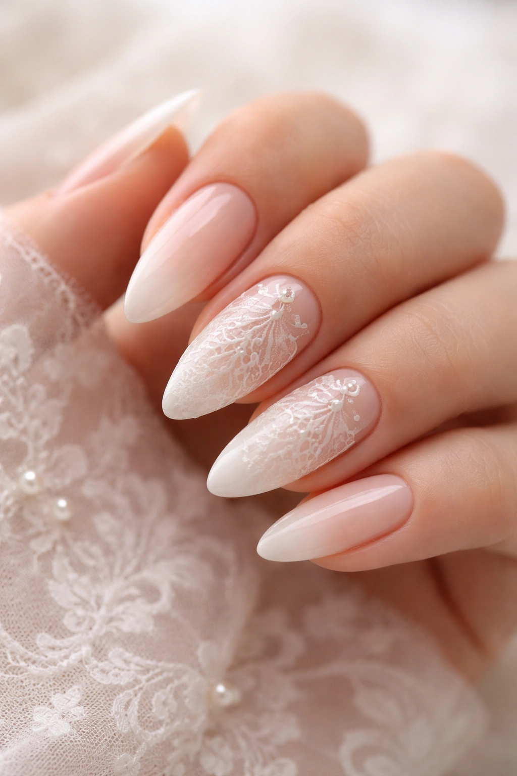 Close-up of White Lace Embossed Nails showing delicate lace patterns on almond nails