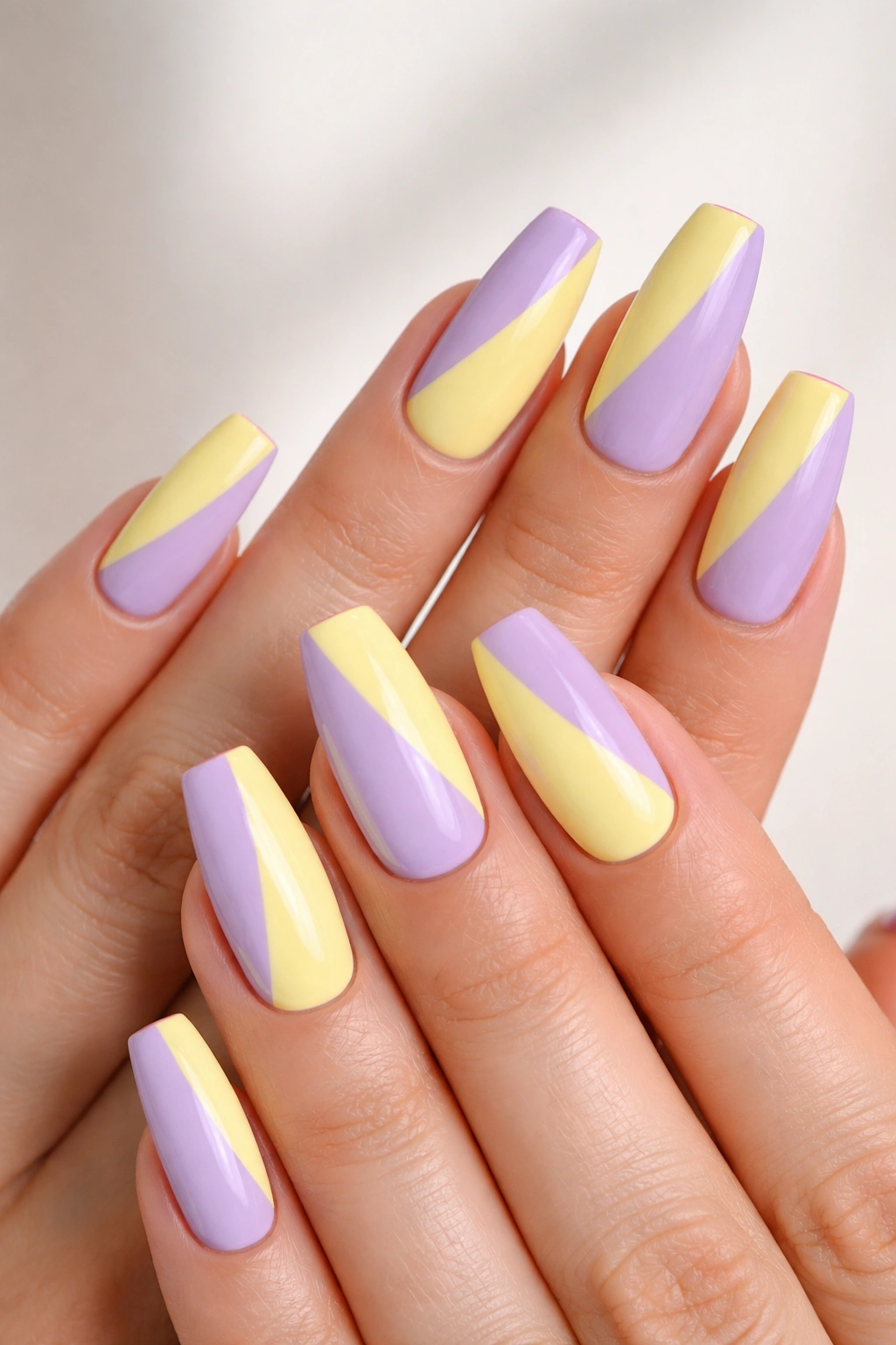 Pastel lavender and lemon color-block coffin nails with gloss