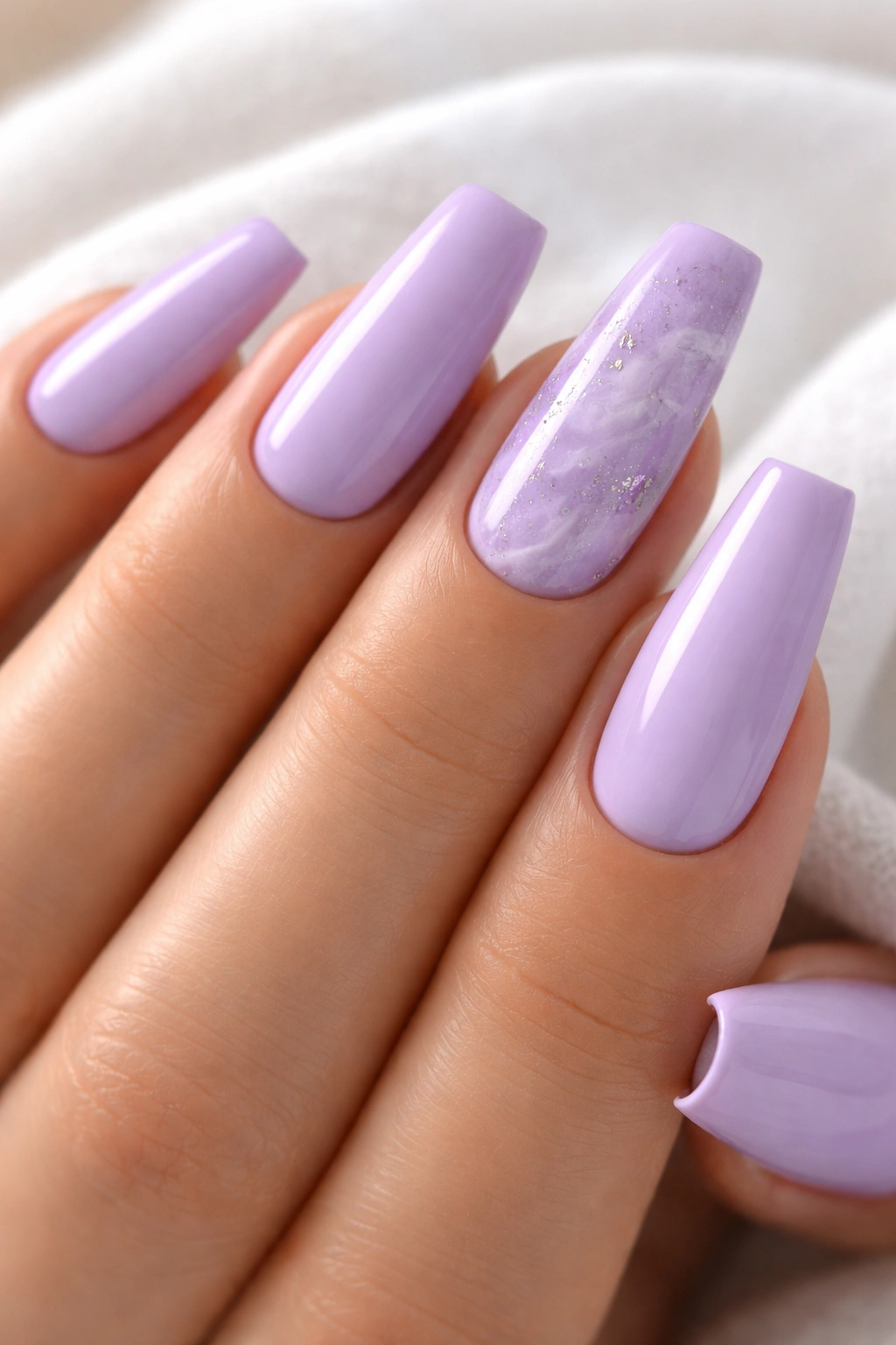 Nails with lavender quartz accents on two fingers among solid lavender nails