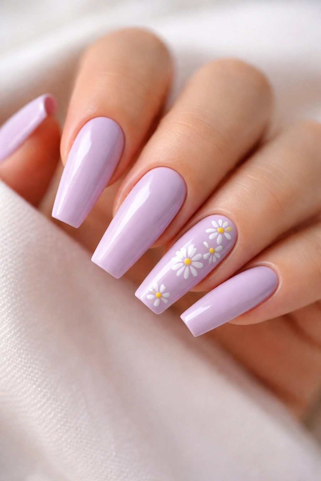 Lilac coffin nails with small hand-painted daisies on accent nails