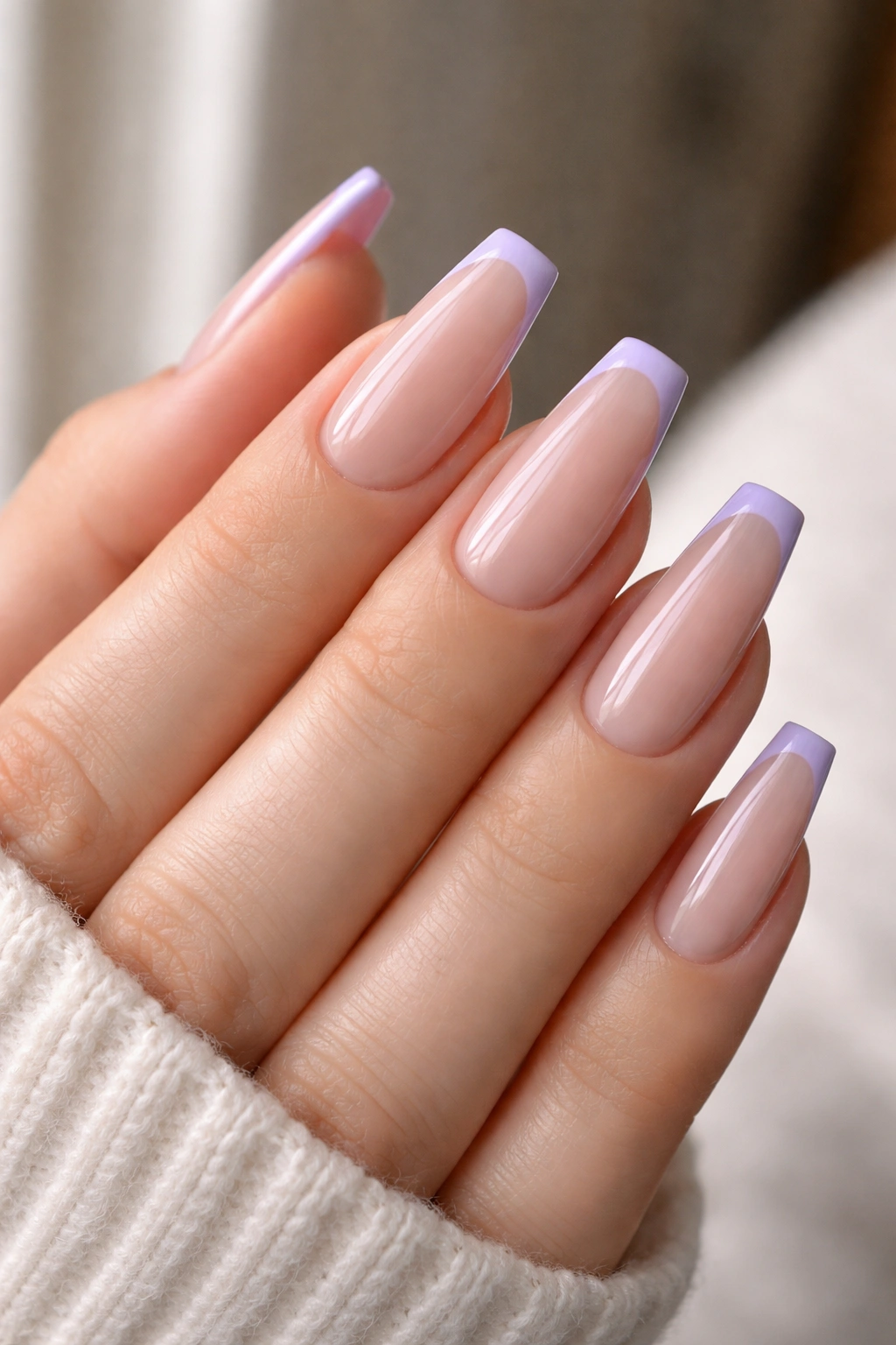 Close-up of lilac micro-French coffin tips on nude base.