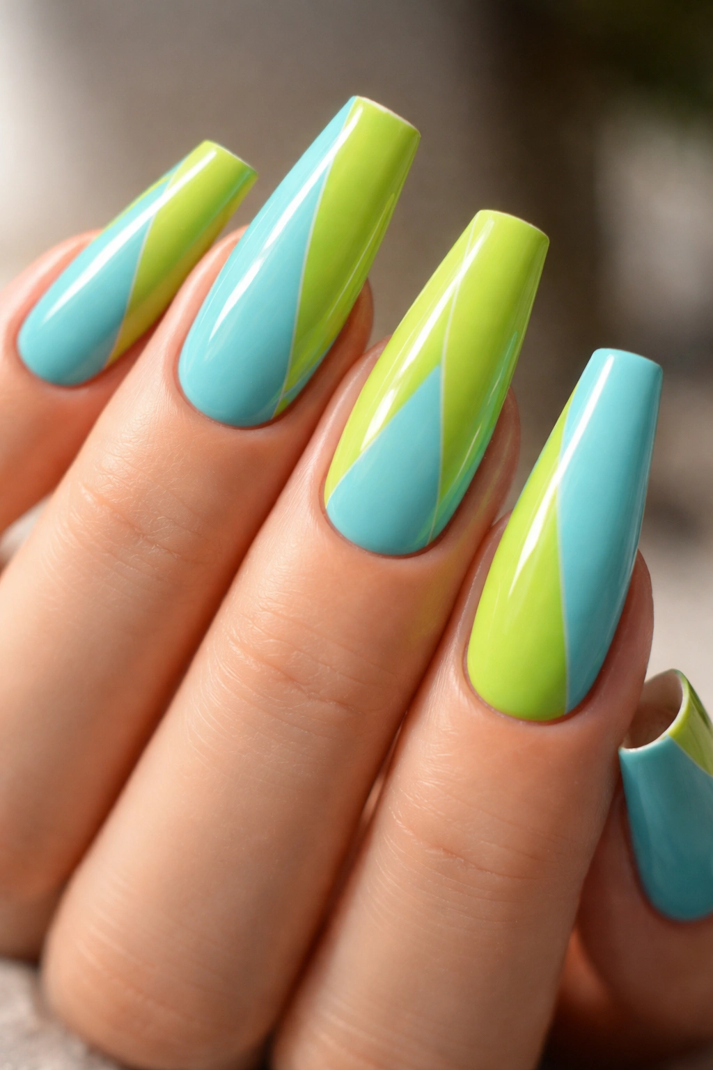 Close-up of lime and aqua color-block ballerina nails with diagonal split