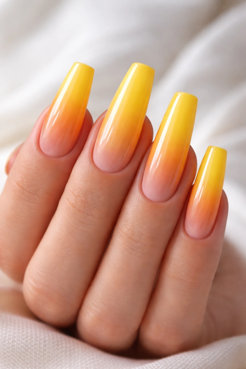 Long coffin nails with mango-to-yellow sunset gradient