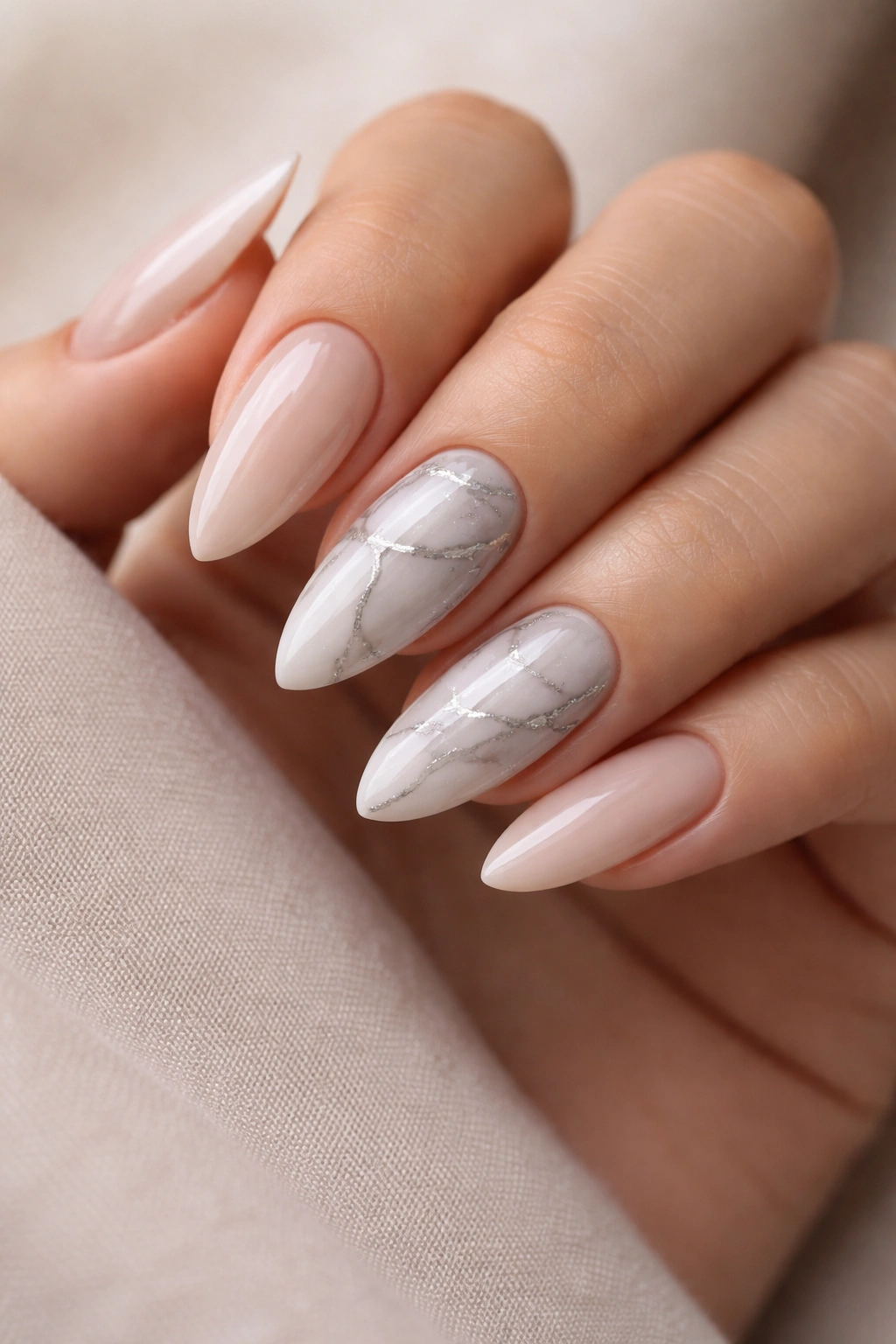 Almond nails with white and grey marble veining