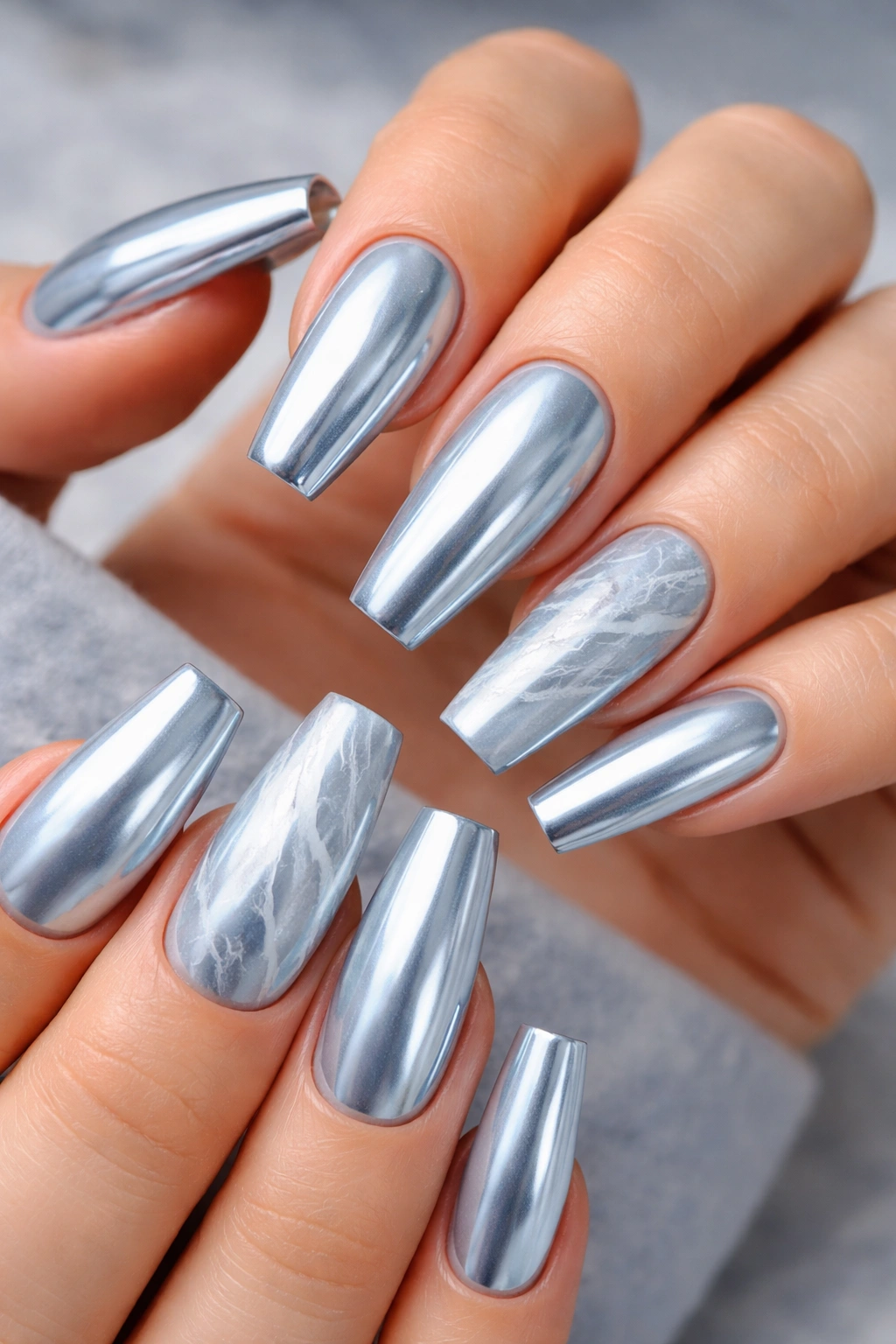 Icy blue chrome coffin nails with fine white marble veins