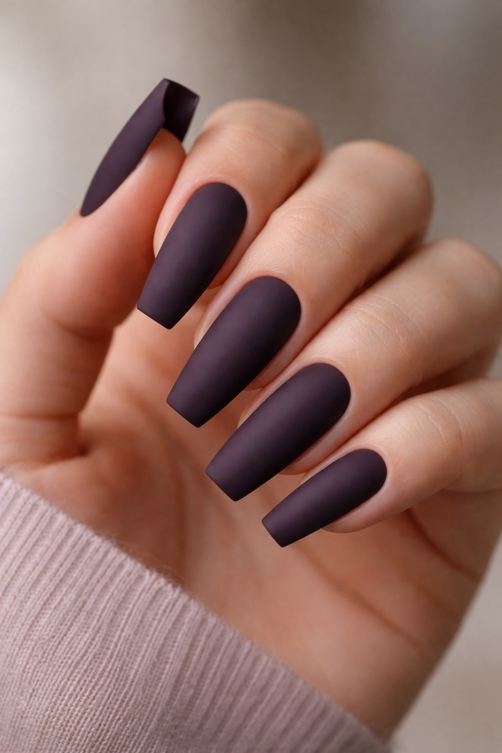 Matte aubergine ballerina nails with crisp taper and straight sidewalls