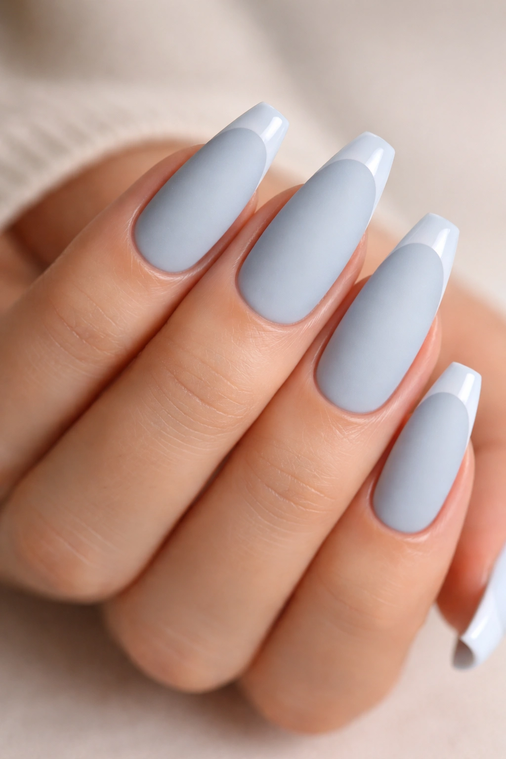 Matte baby blue nails with glossy French tips