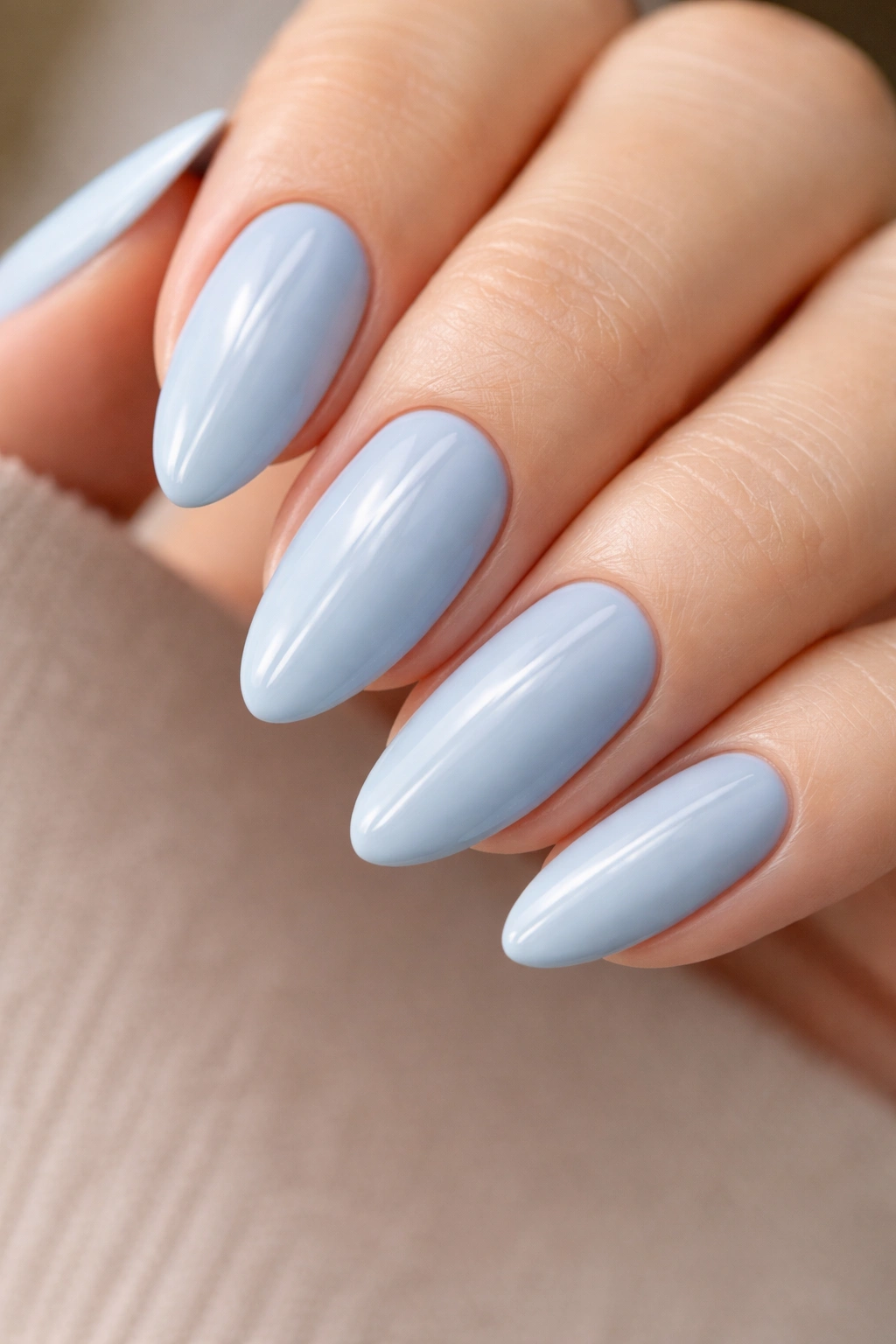 Almond nails matte blue with a thin glossy stripe