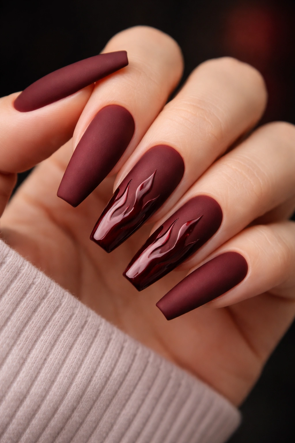 Matte burgundy coffin nails with glossy flame accents