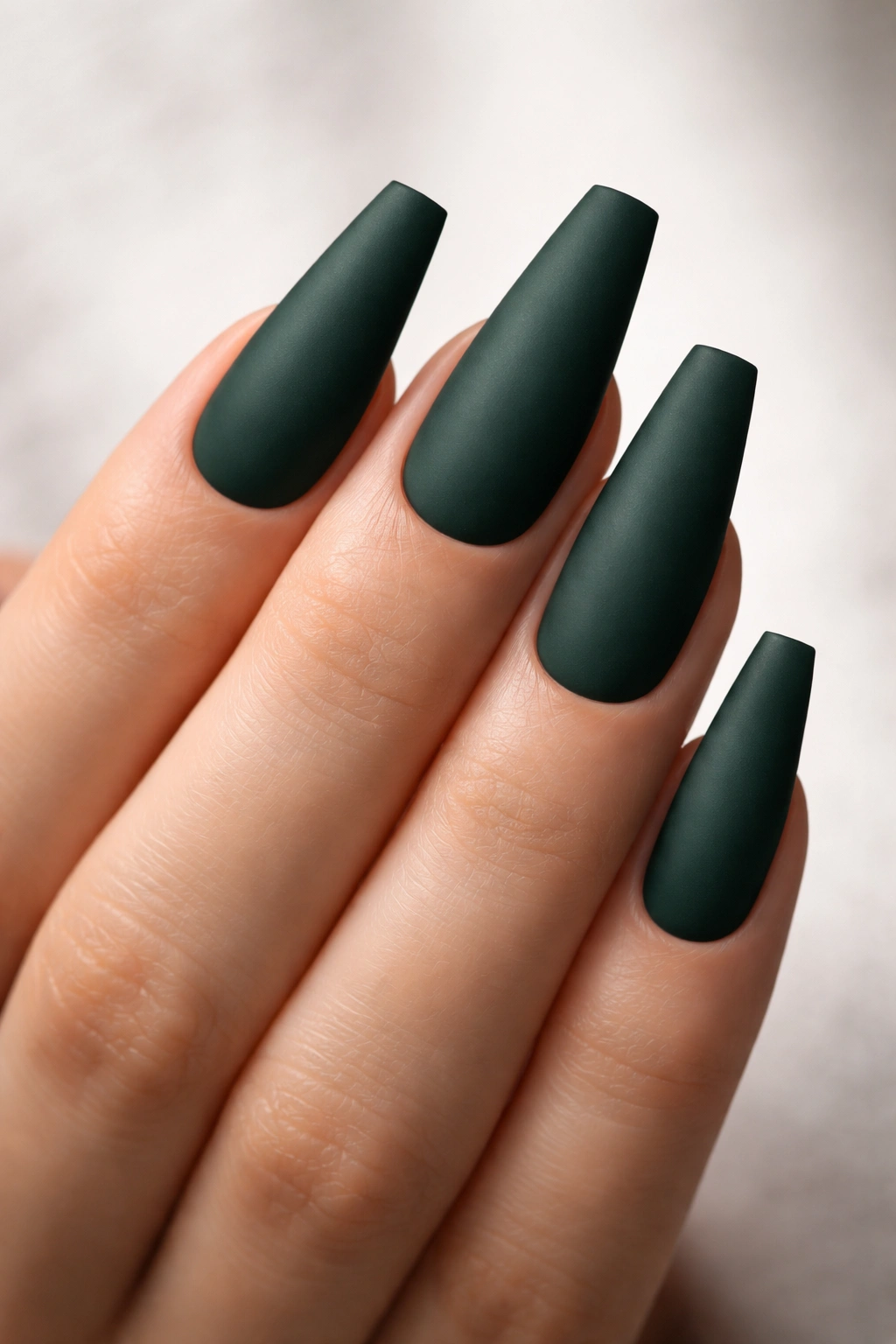 Matte hunter green coffin nails with sharp edges