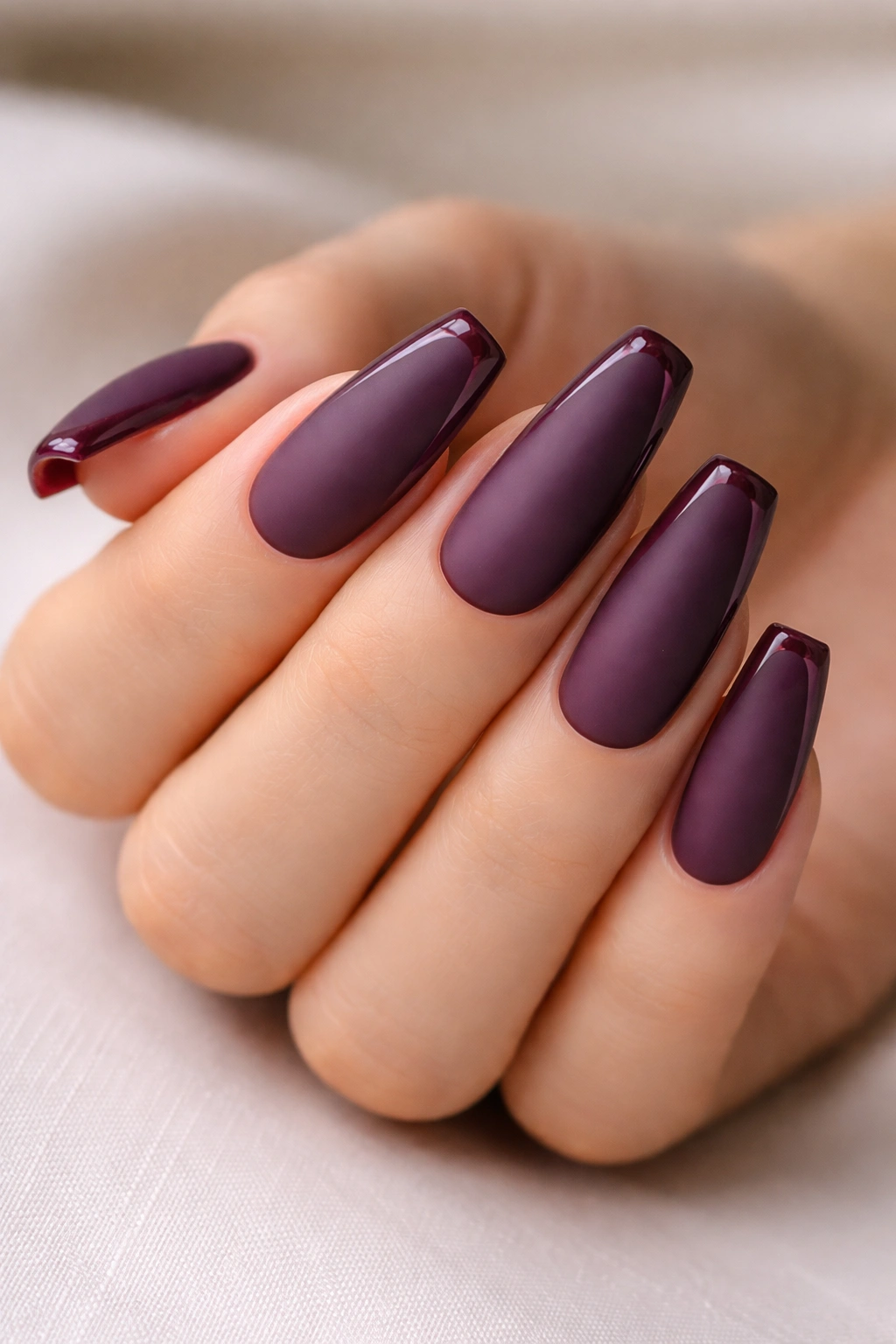 Matte plum nails with glossy French outline on ballerina tips