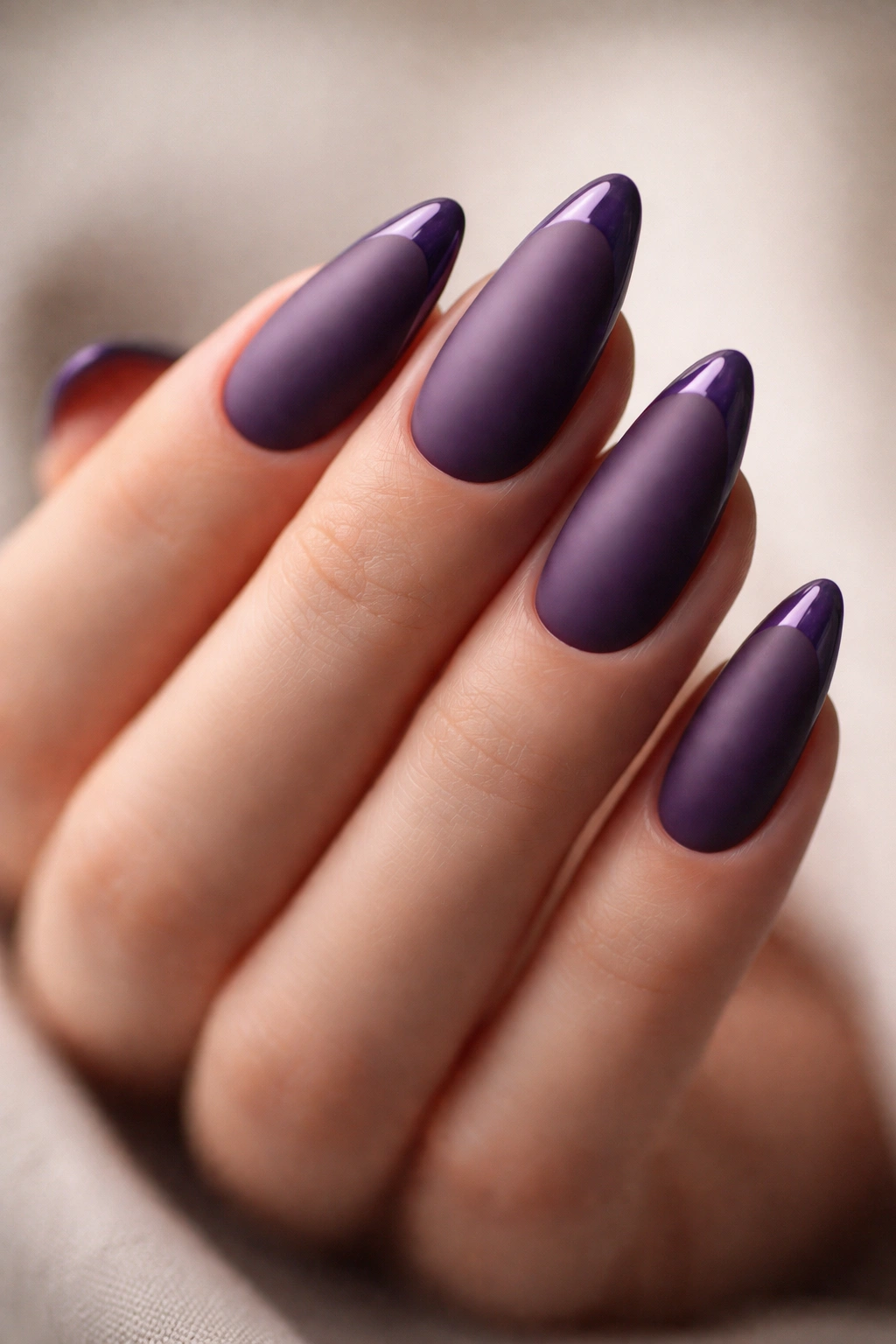 Matte violet almond nails with a thin glossy tip line
