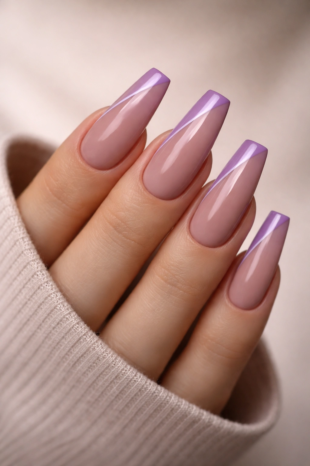 Close-up of mauve nude coffin nails with violet side French