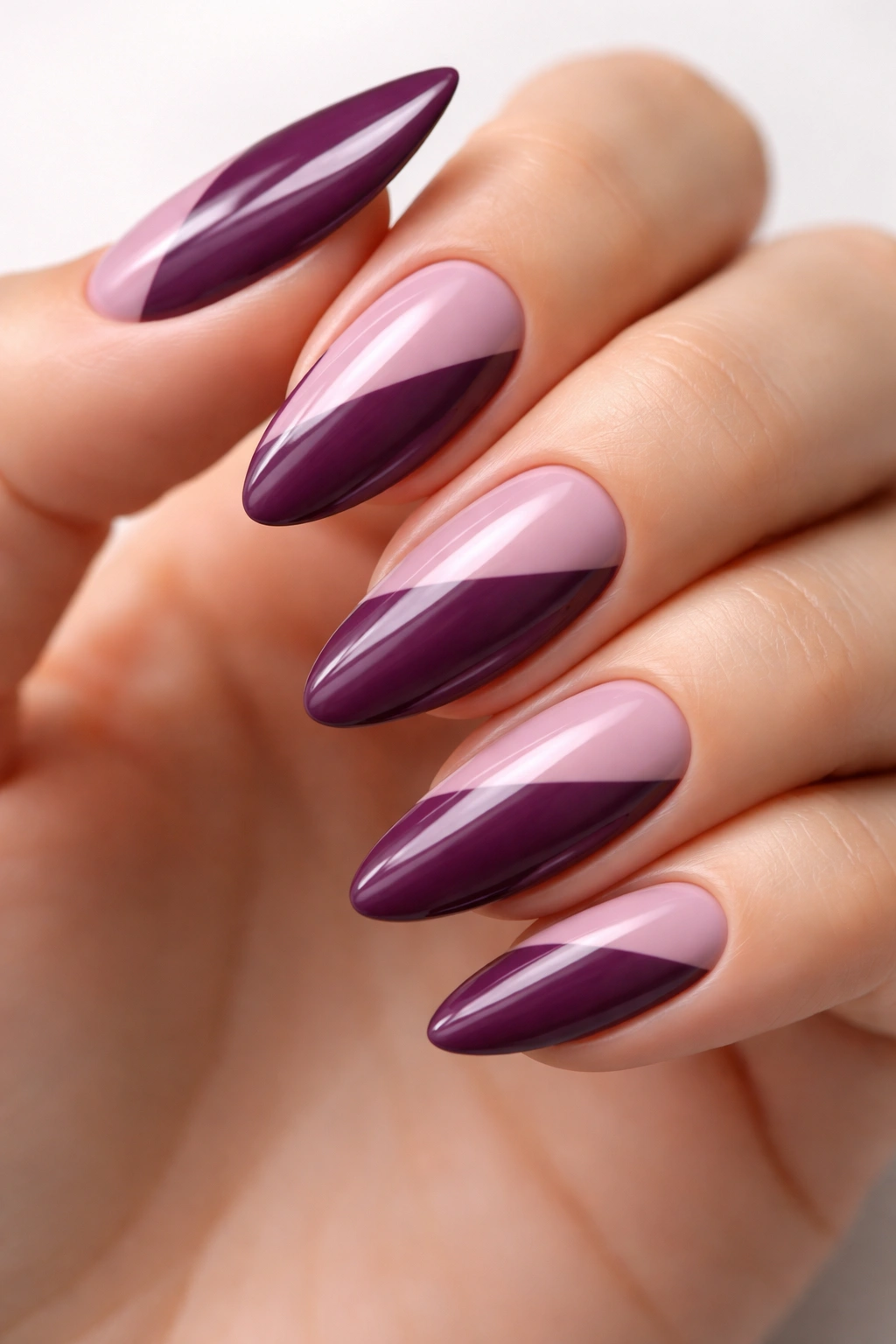 Almond nails with mauve and plum diagonal color blocking