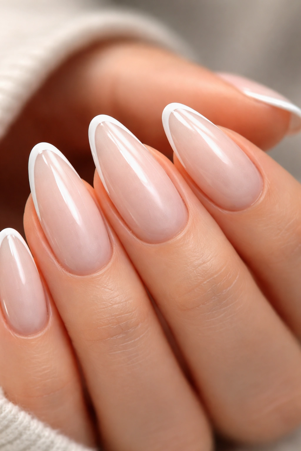 Almond nails with micro-French white chrome line at the tip