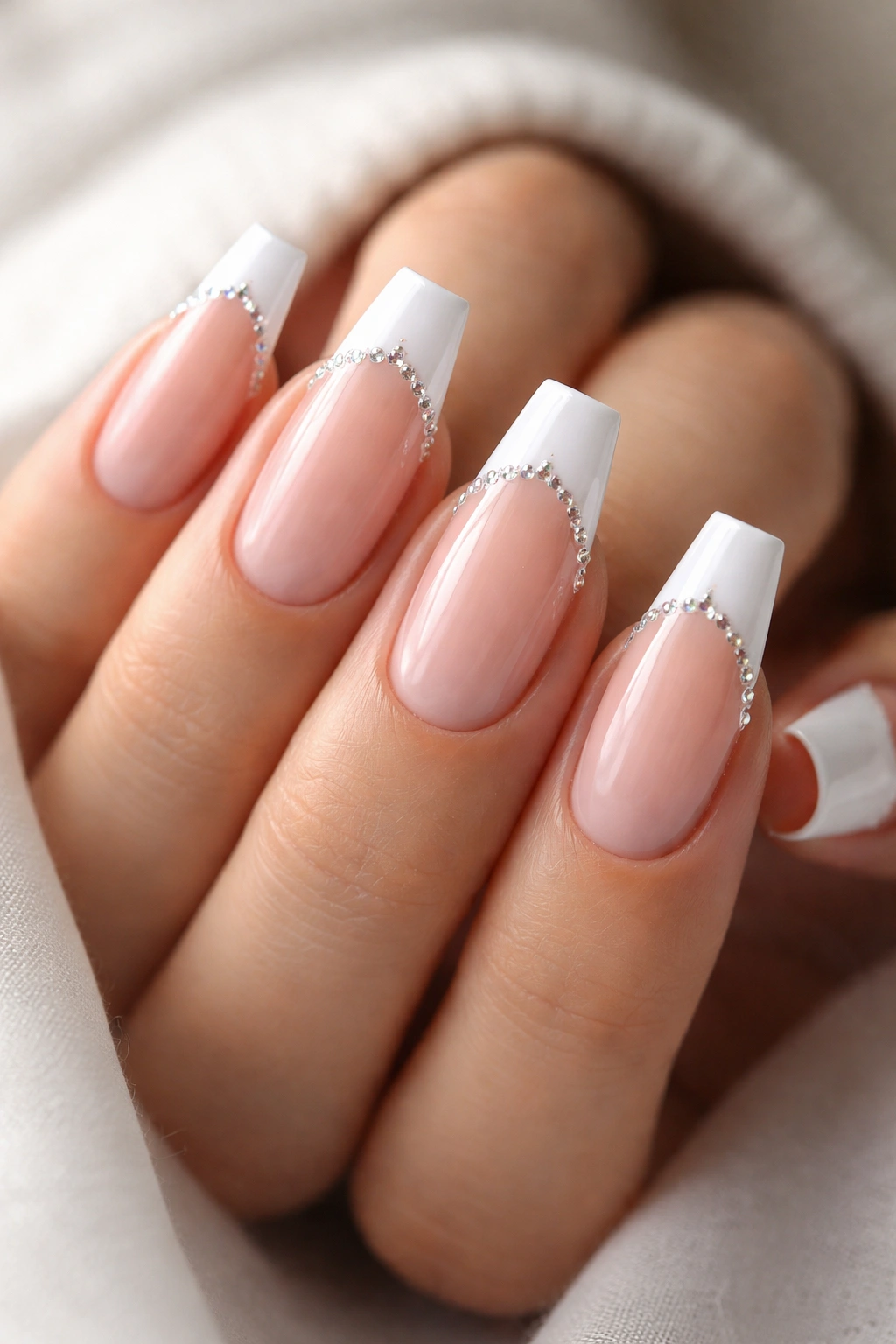 Micro-French coffin nails with tiny gems along the smile line