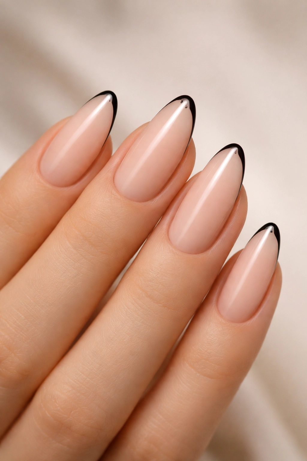 Almond nails with micro black French lines on sheer base
