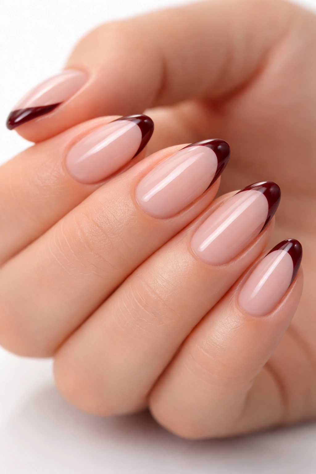 Almond nails with micro French deep merlot tip on sheer base.