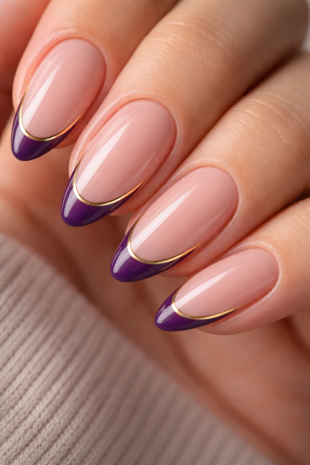 Almond nails with ultra-thin violet micro French tip and gold edge.