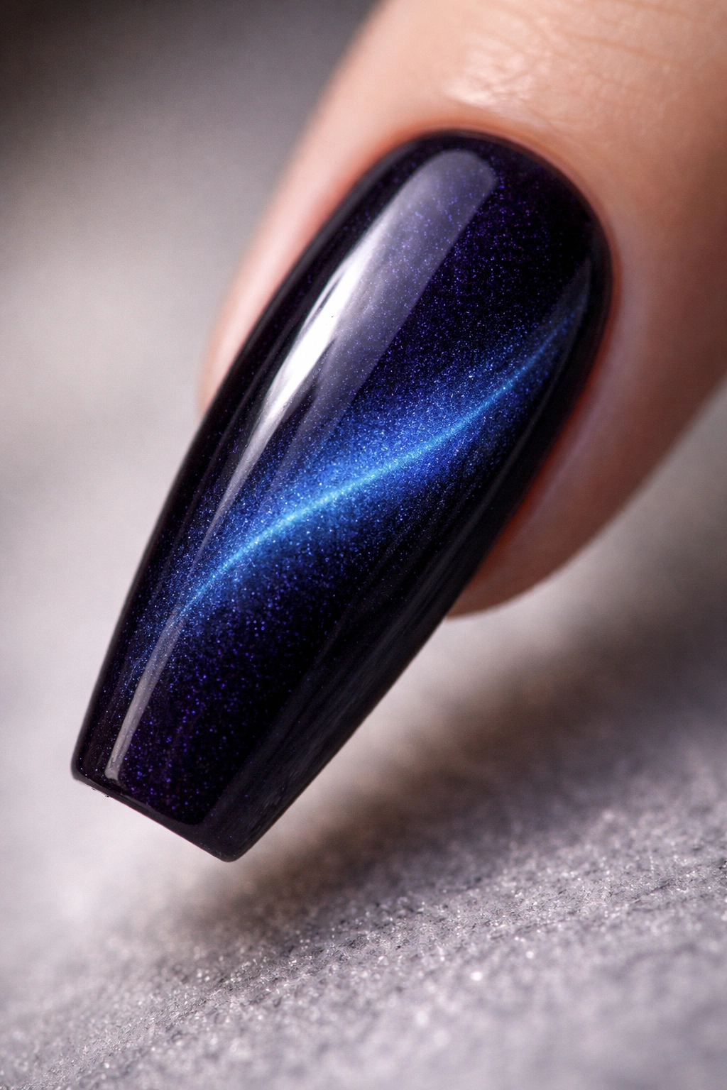 Midnight indigo cat eye nail with hidden glow powder