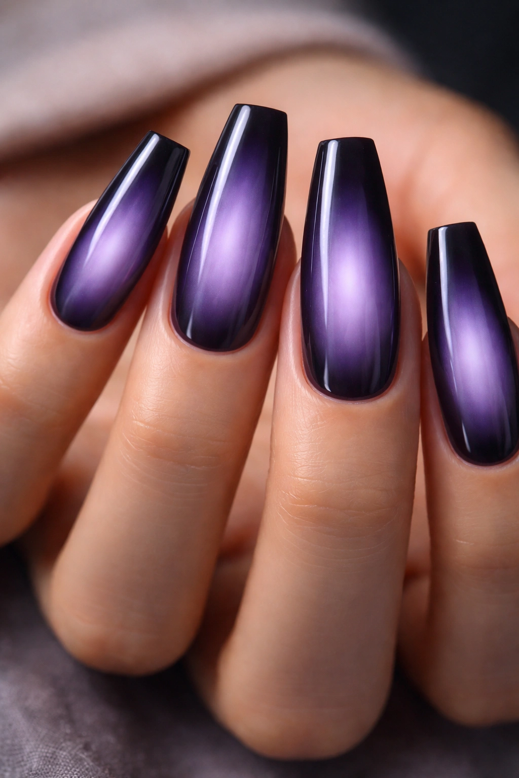 Close-up of Midnight Lavender Aura Ballerina Nails with dark edge fading into lavender center, glossy finish