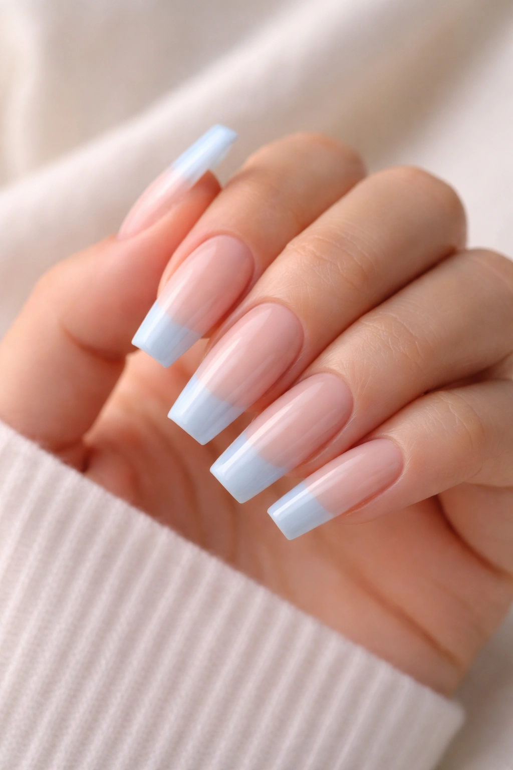 Coffin nails milky nude base with sky blue tips