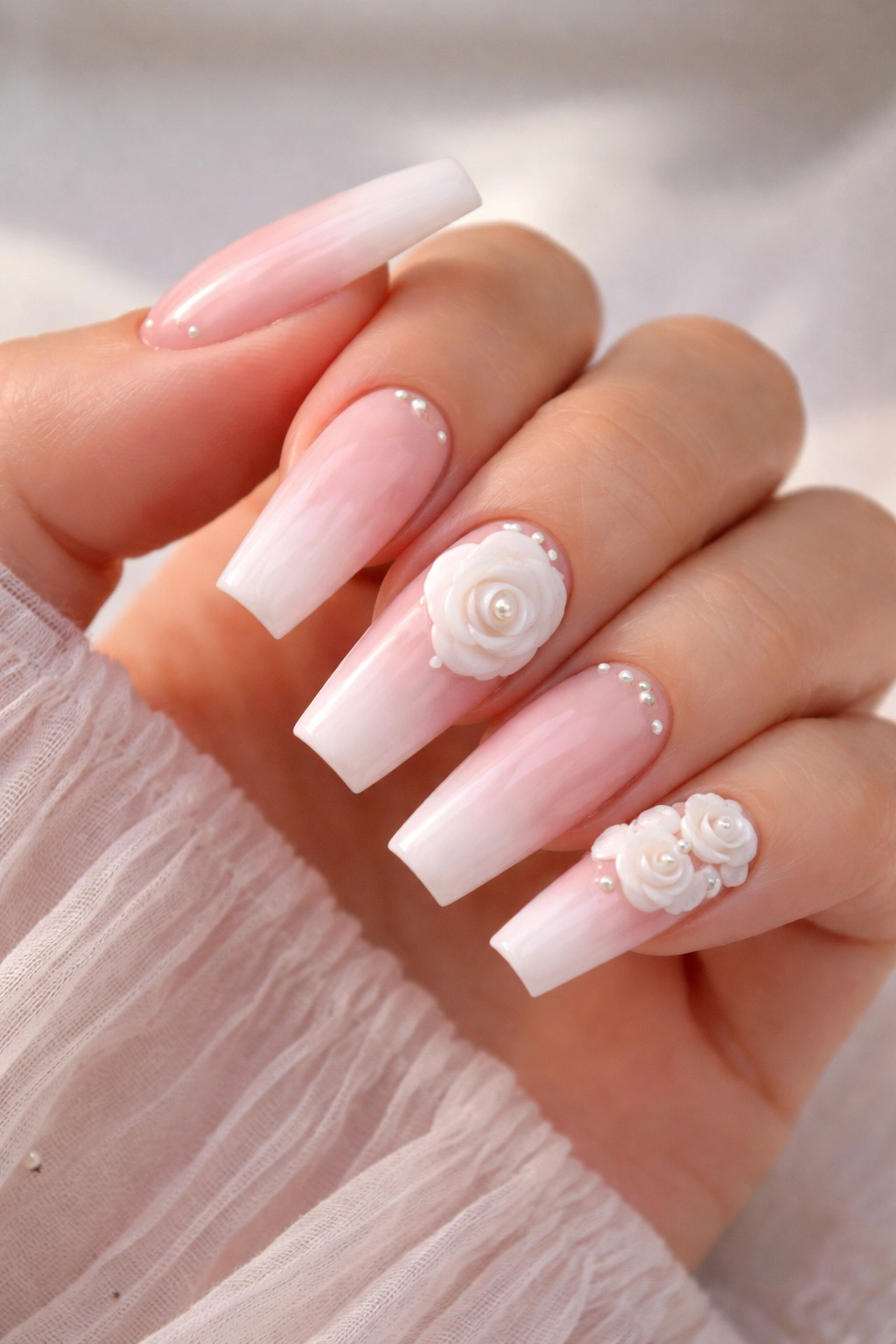 Milky pink 3D coffin nails with a full flower on ring finger