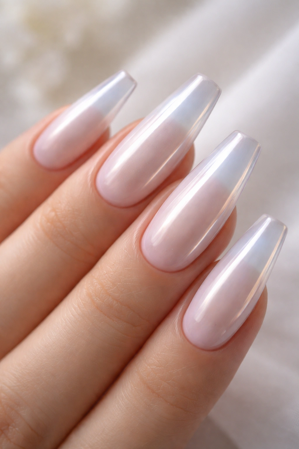 Milky white chrome coffin nails glowing with glassy finish