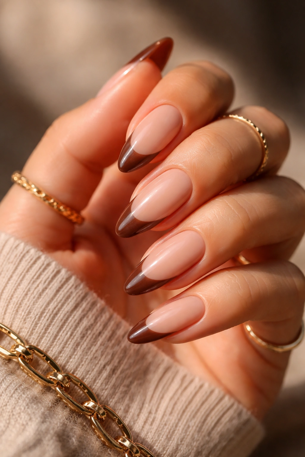 Almond nails with mocha espresso French tips on nude base