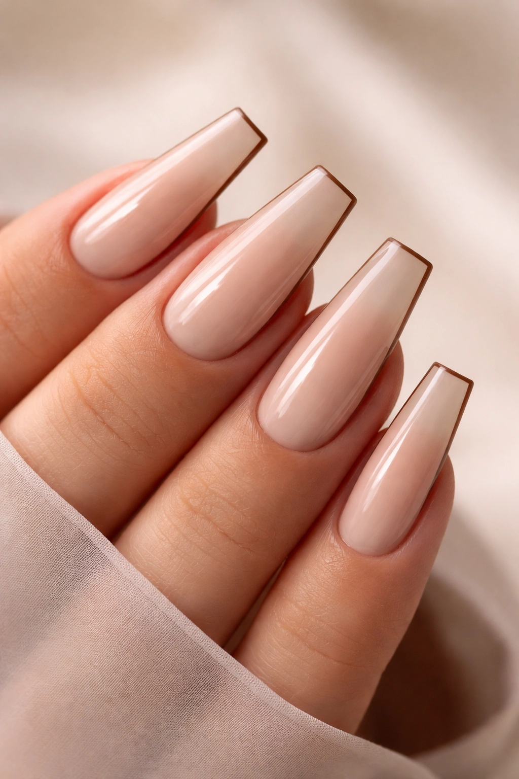 Coffin nails with a thin mocha outline along the edges
