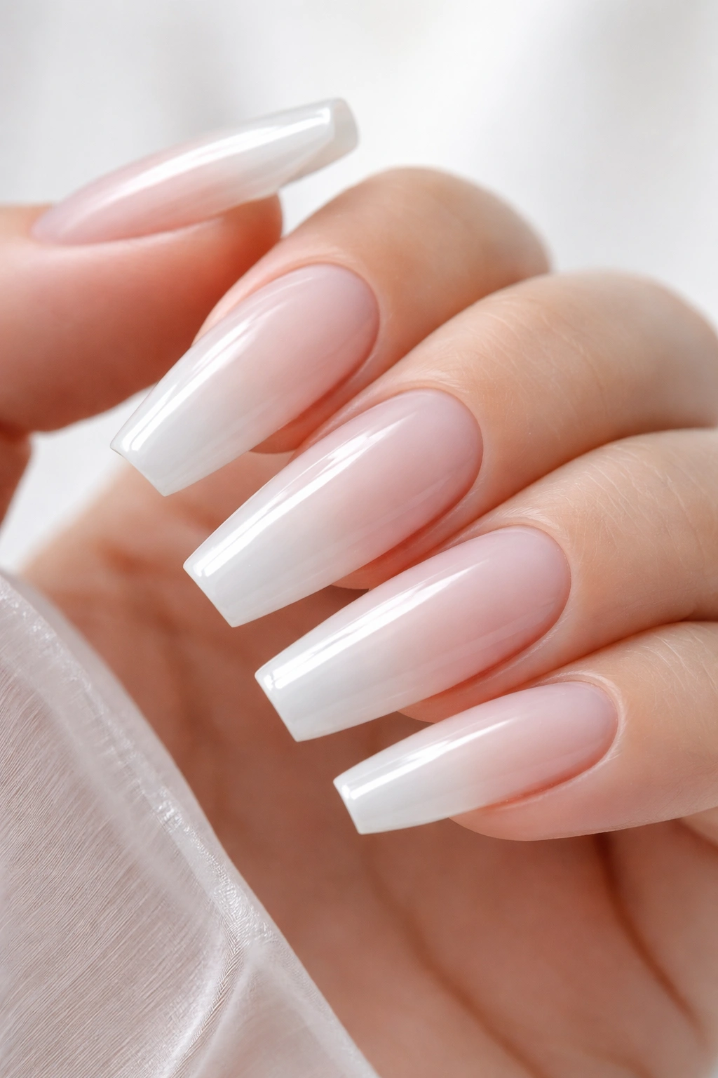 Close-up of translucent jelly white nails showing a washed-glass effect.
