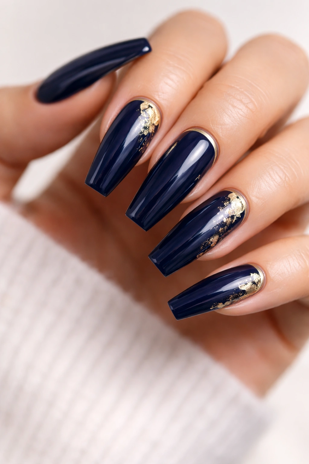 Navy blue coffin nails with sparse gold foil accents and high-gloss finish