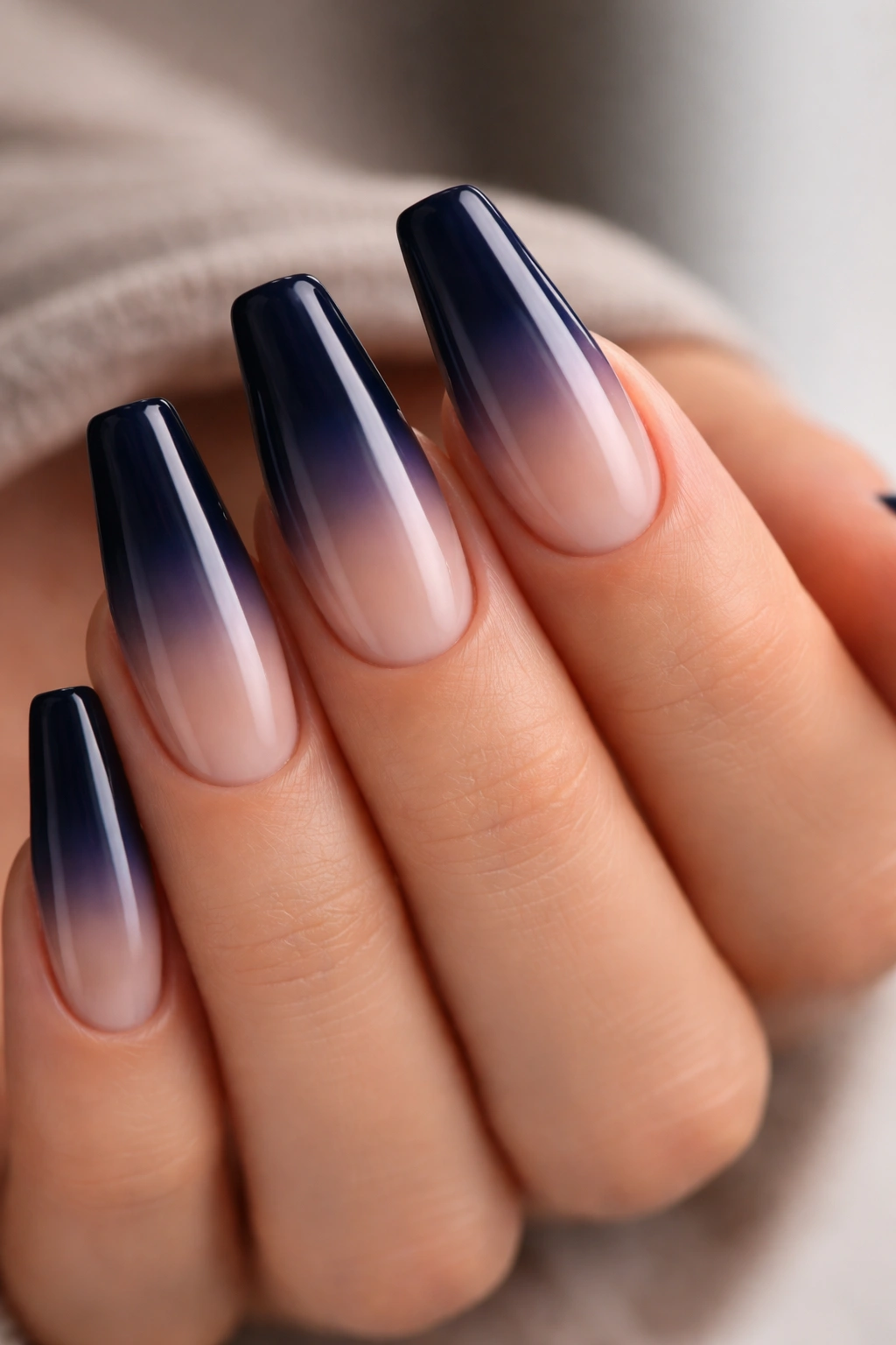 Navy-to-nude ombre coffin nails.