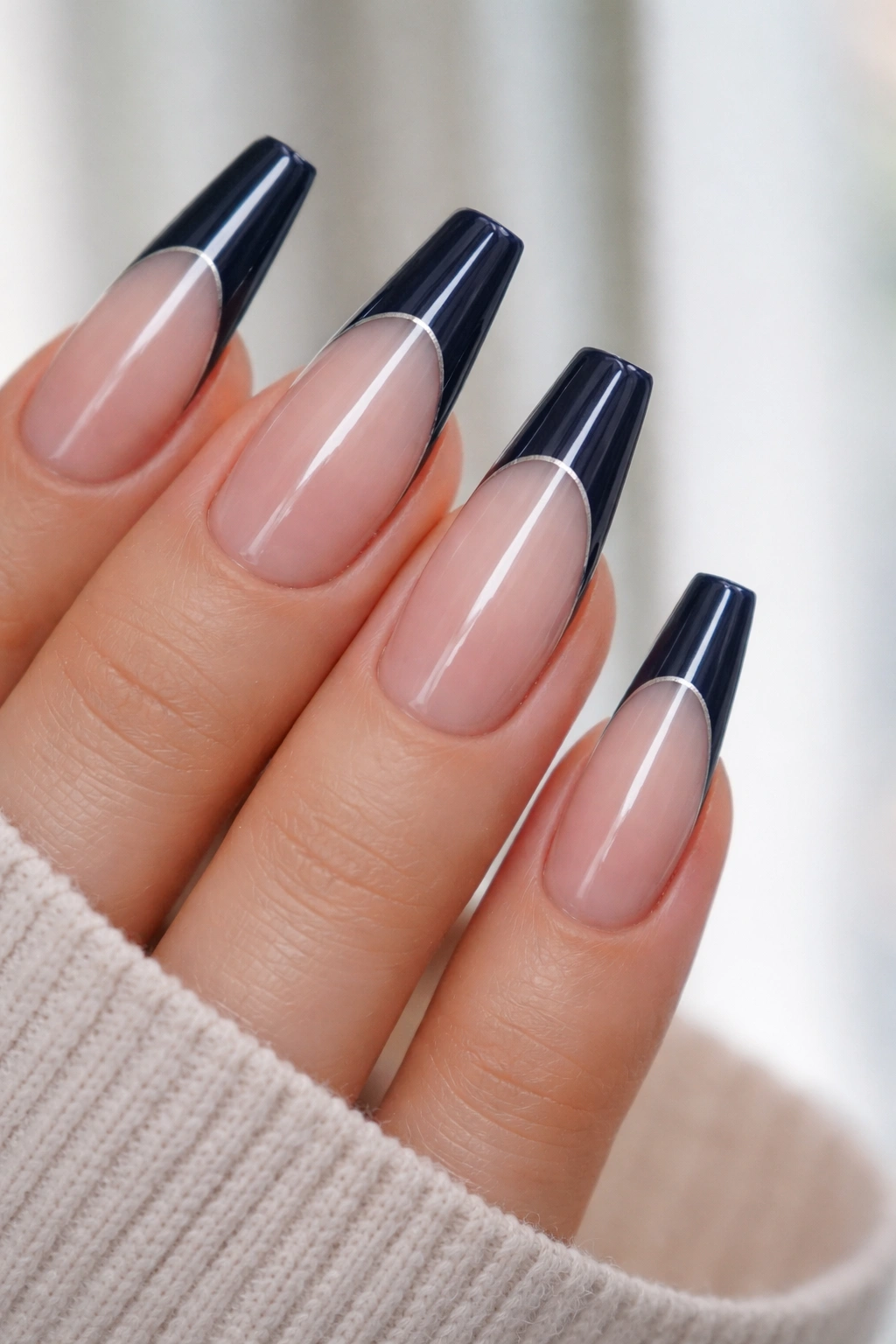 Navy tips with a fine silver pinstripe outlining the edge