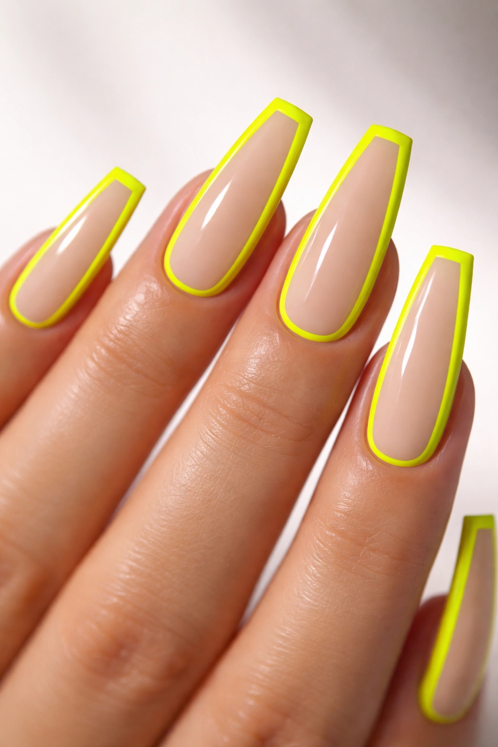 Neon yellow outline coffin nails with nude center