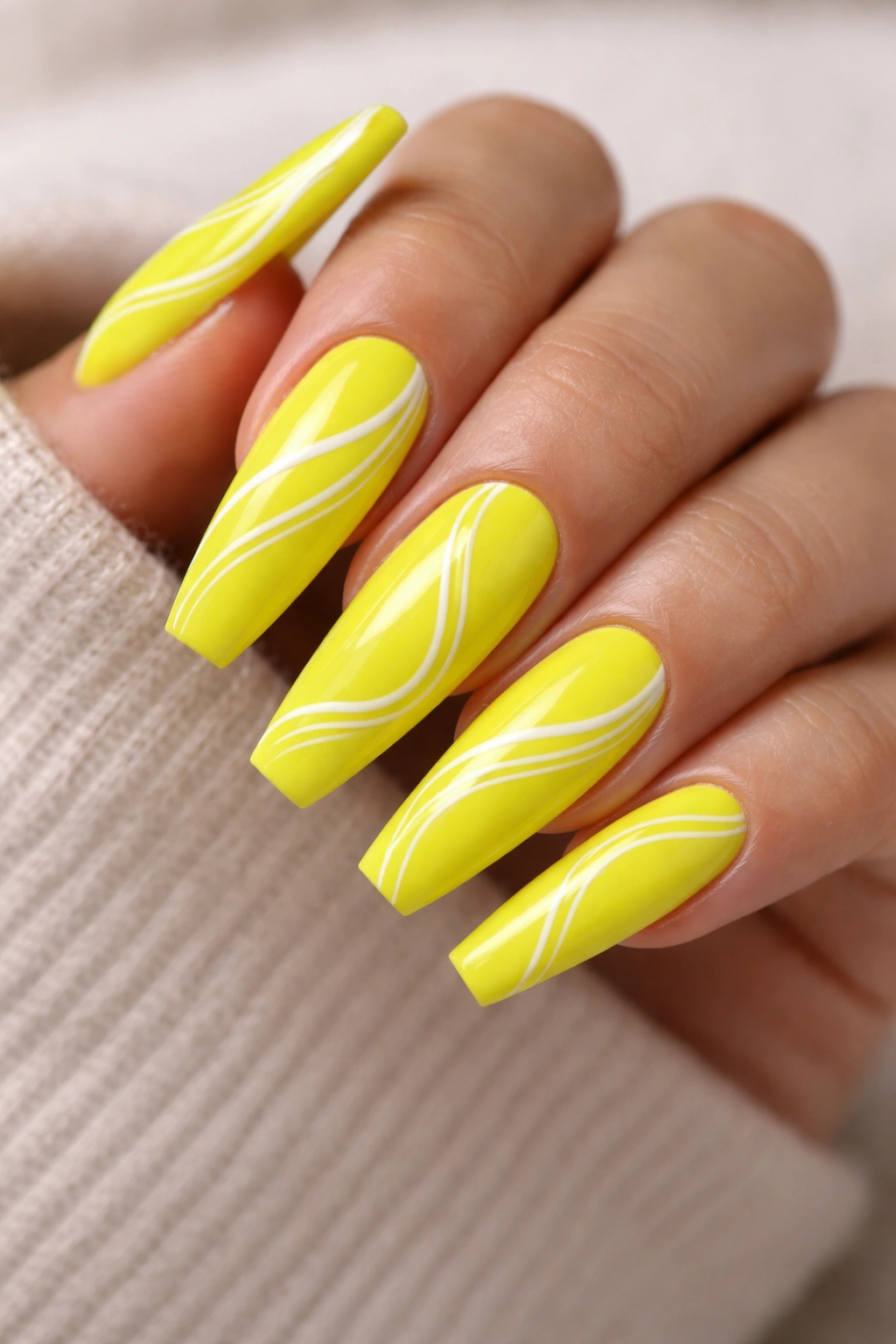 Neon yellow coffin nails with thin white swirls