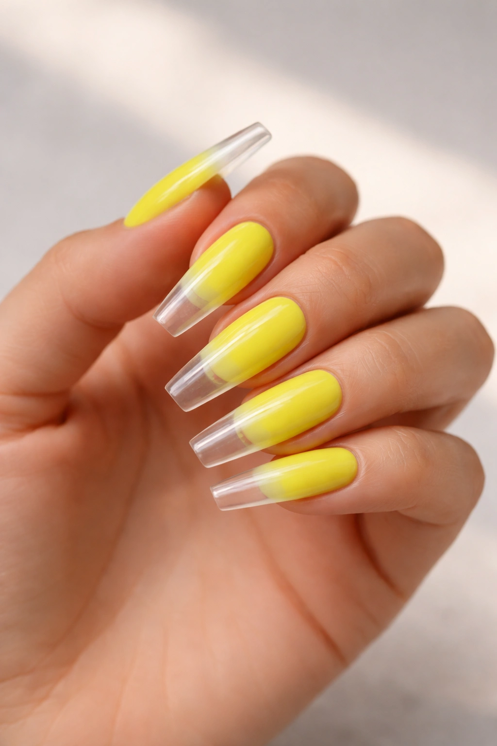 Neon yellow ombre coffin nails with clear jelly tips