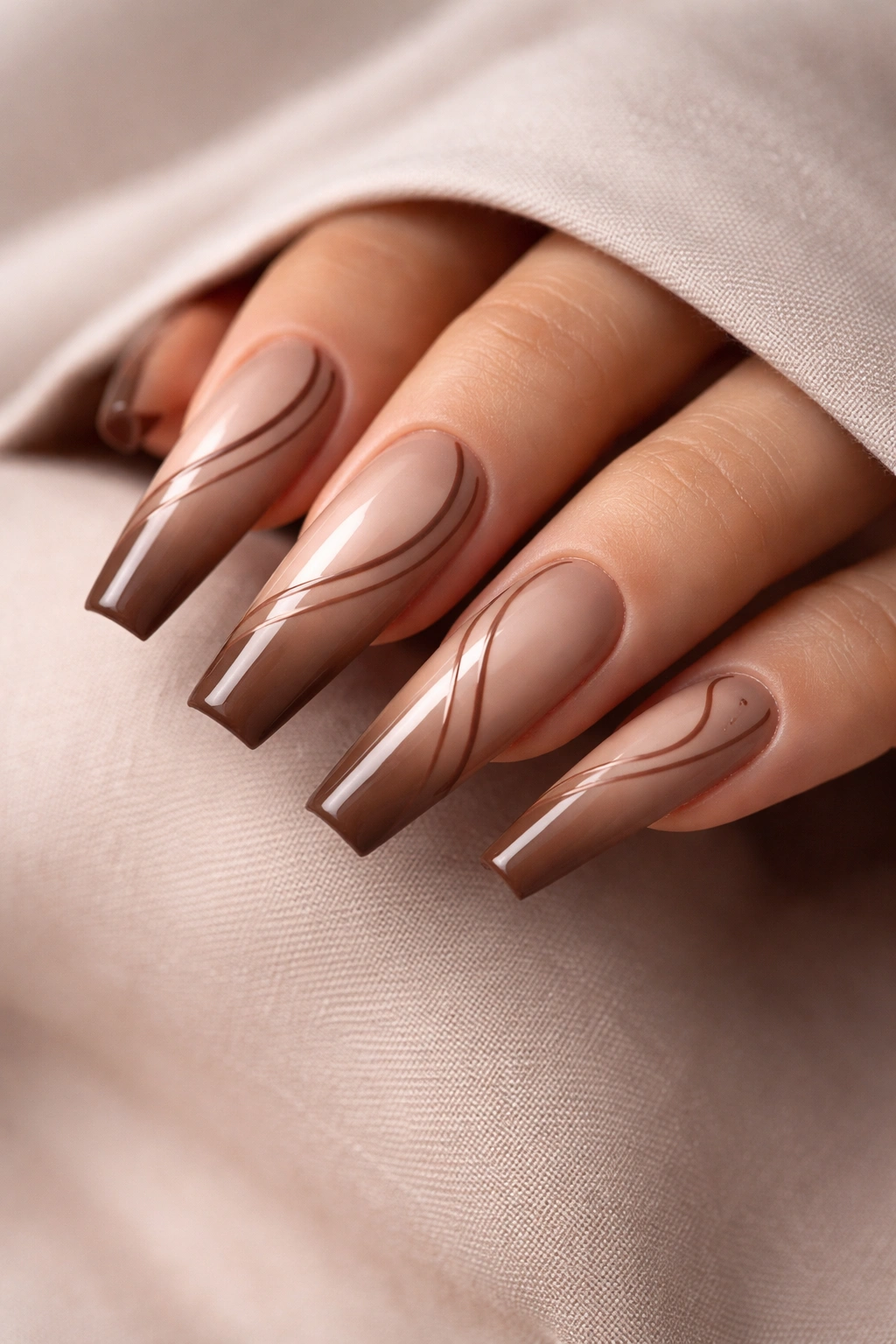 Nude to cocoa swirl coffin nails with thin brown lines
