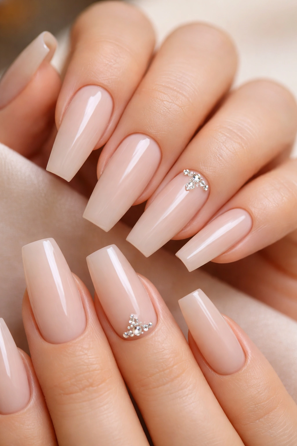 Milky nude coffin nails with tiny crystals at the cuticle on one or two nails