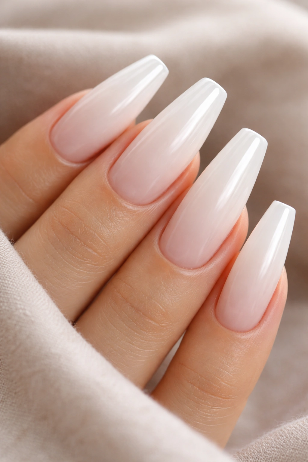 Milky white coffin nails with nude cuticle shadow