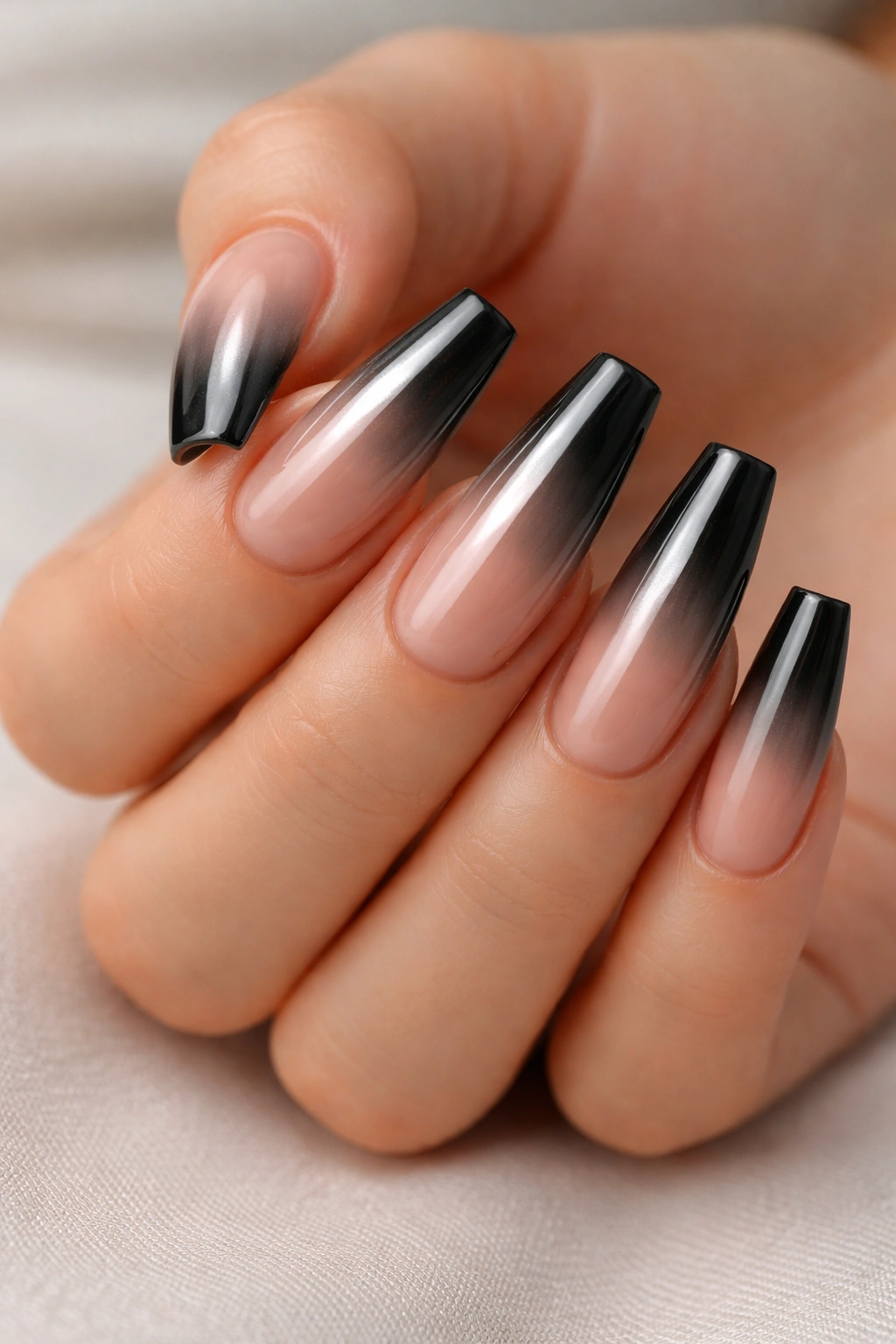 Coffin nails with nude-to-black chrome soft fade