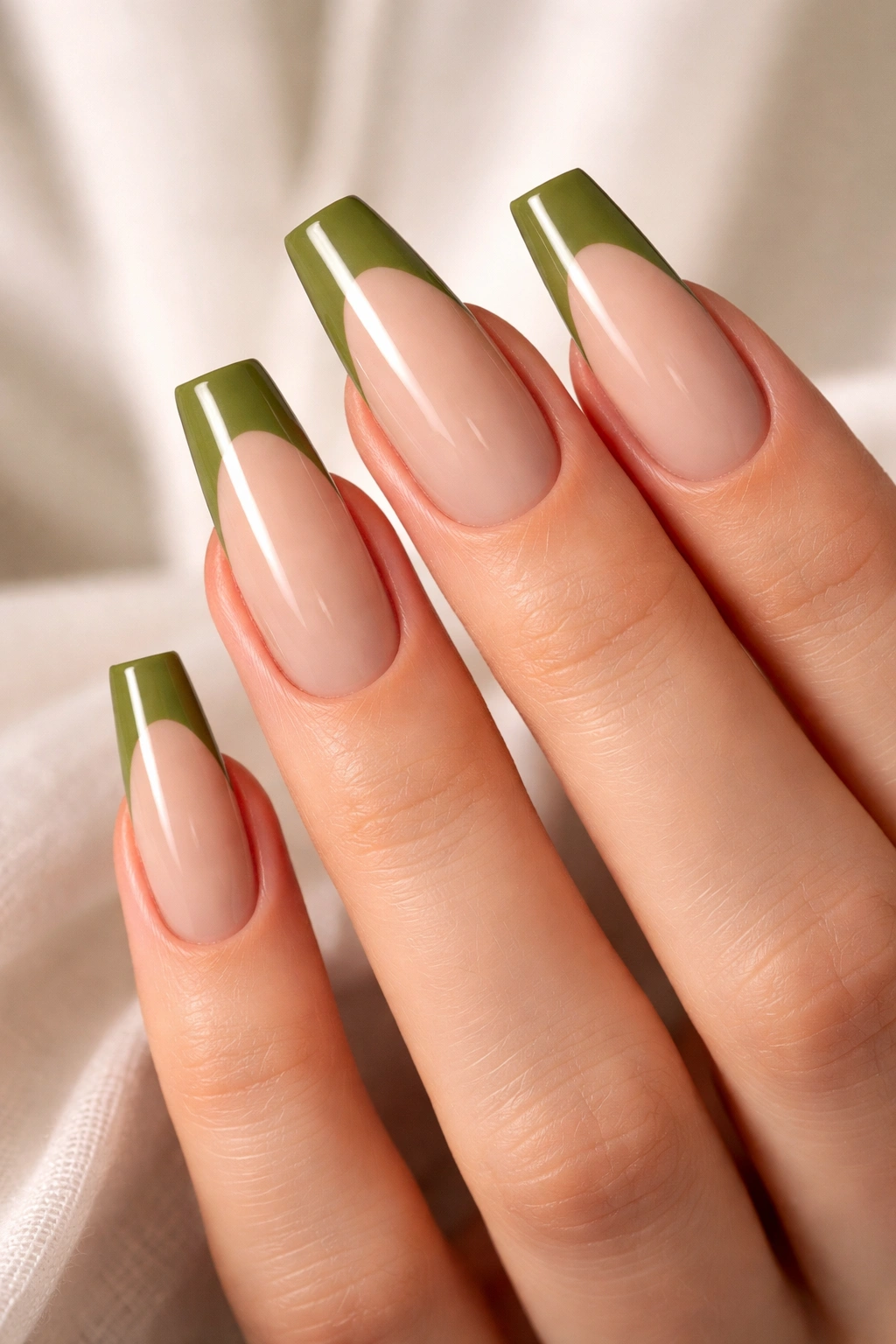 Coffin nails with olive green French tips on a nude base
