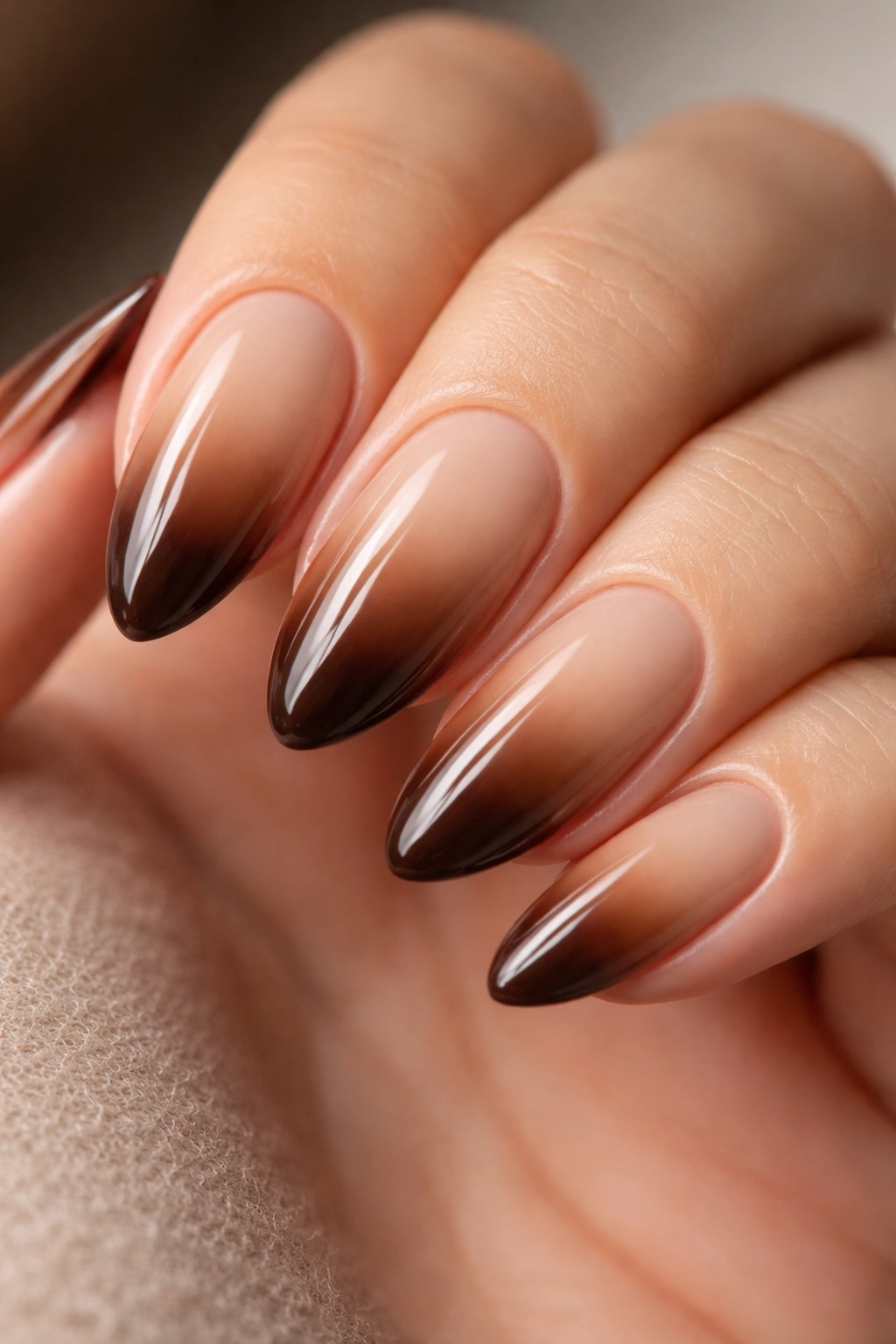 Almond nails with beige to espresso ombre gradient