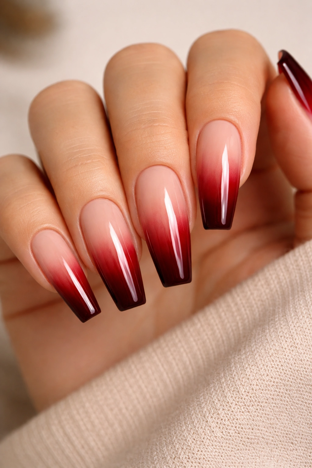 Coffin nails with nude-to-burnt cherry ombré on long nails