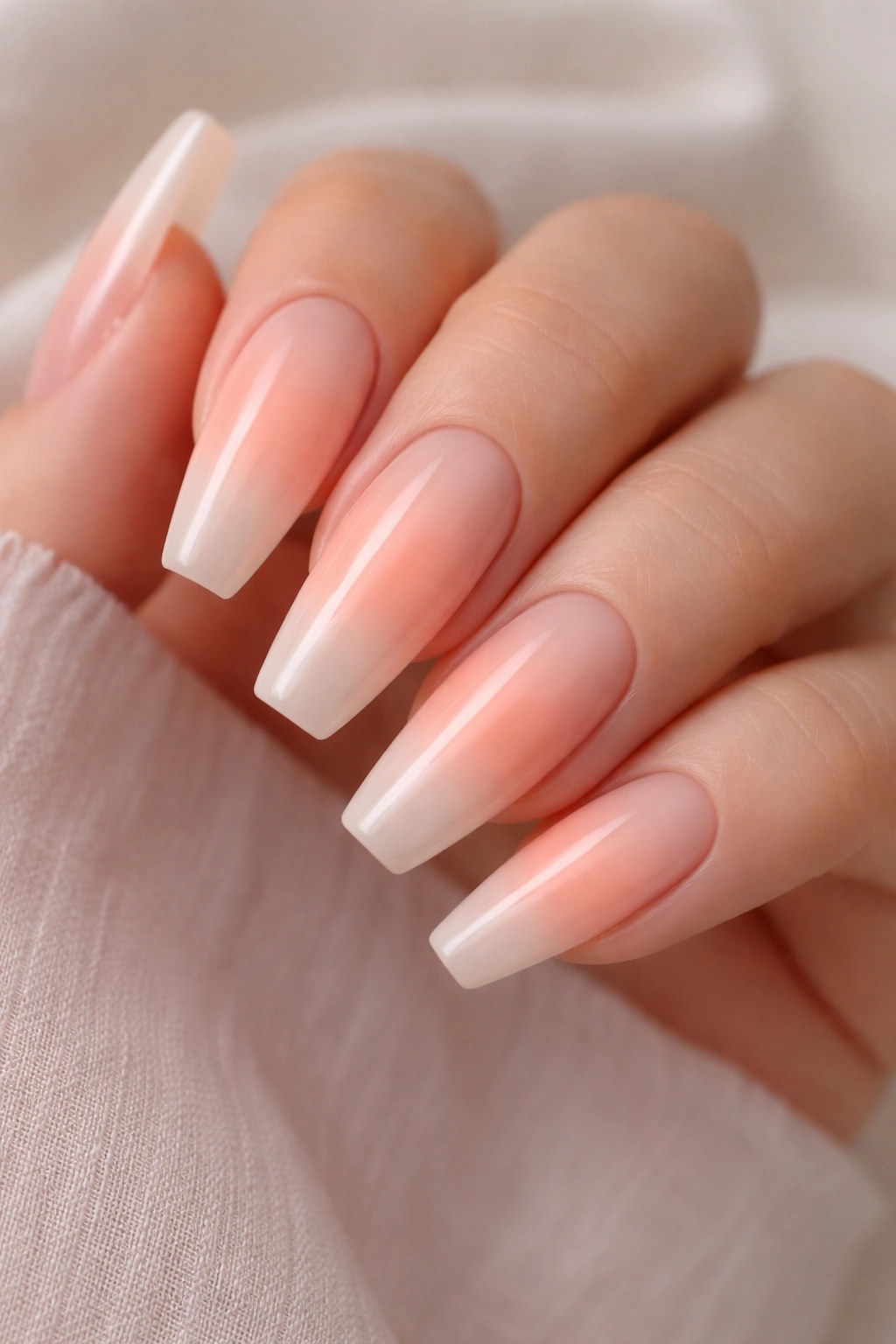 Peach blush aura coffin nails with centered glow
