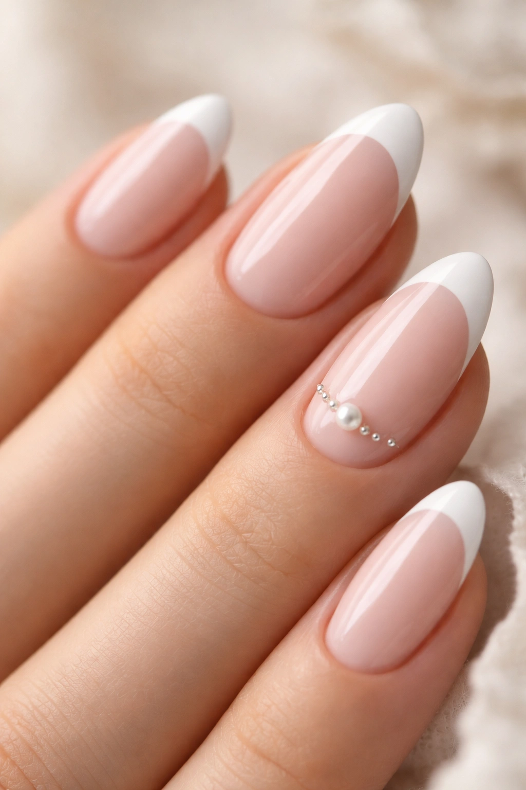 Almond nail with pearl accent on French tip