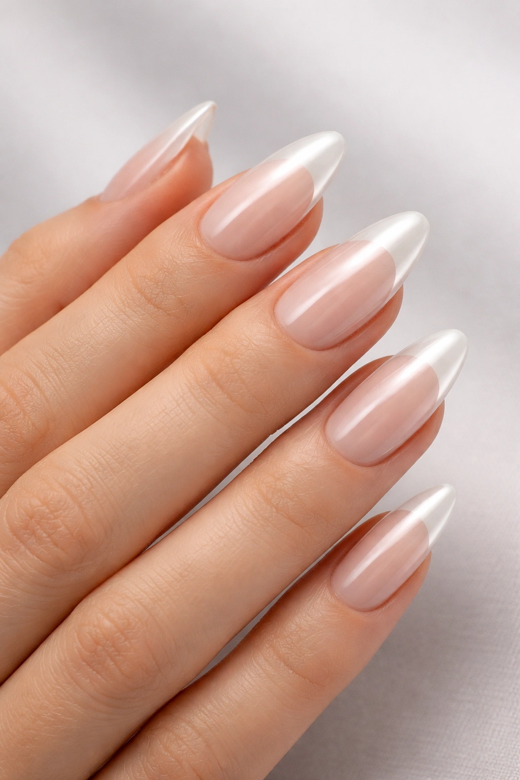 Almond nails with pearl tips and satin-like finish
