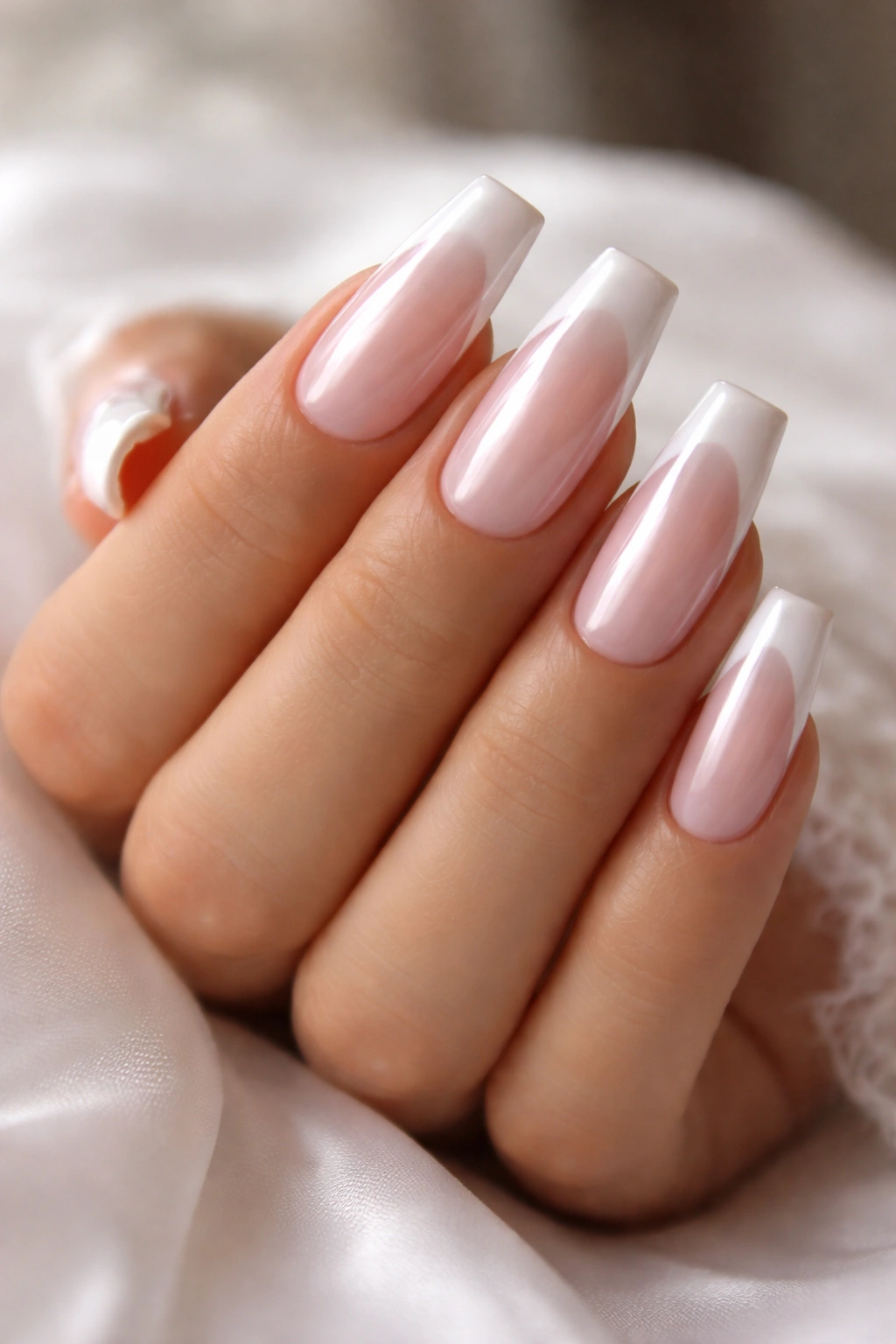 Nails with pearl-gloss finish on pink and white French tips