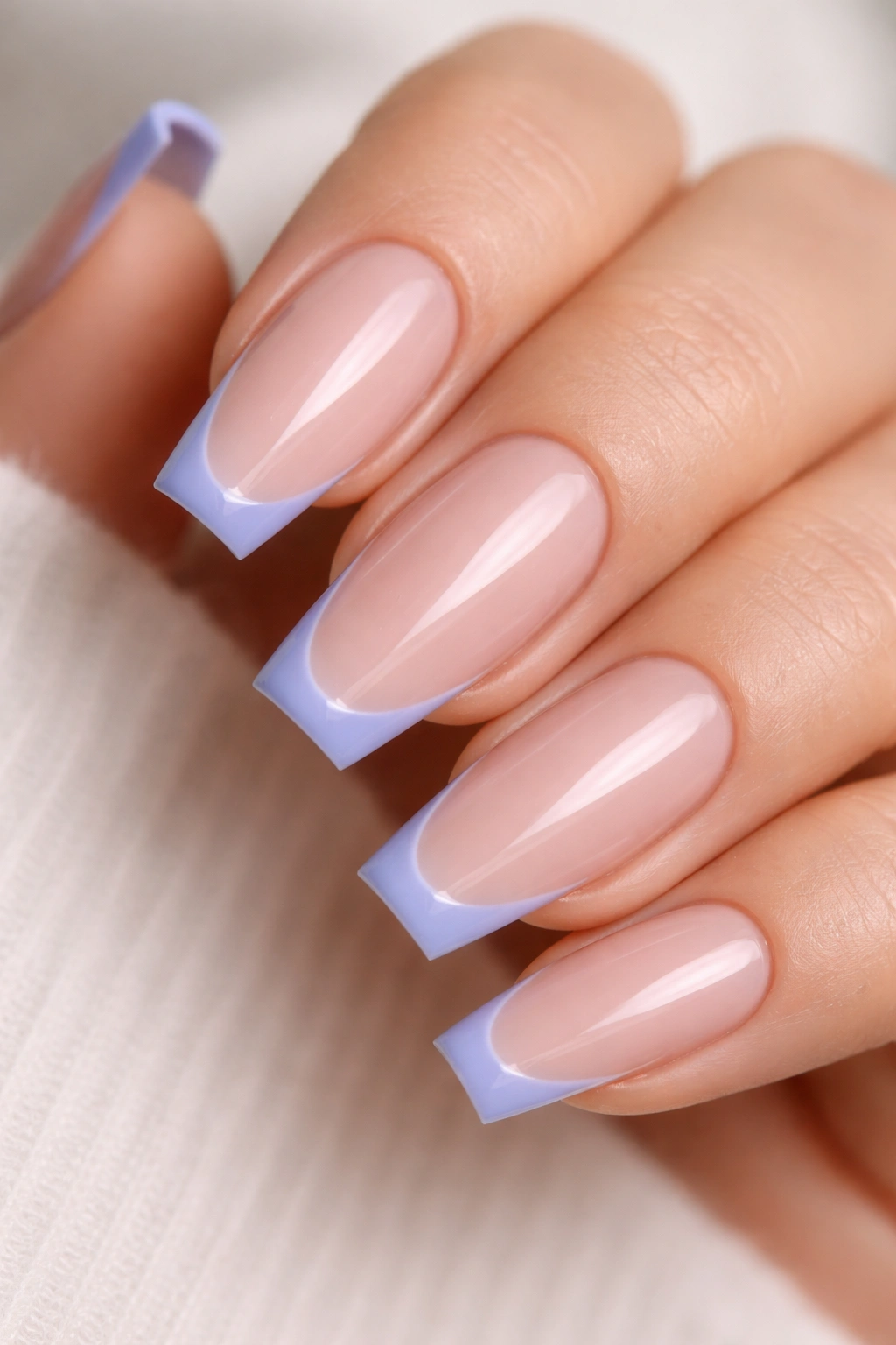 Periwinkle micro-French coffin nail tips.