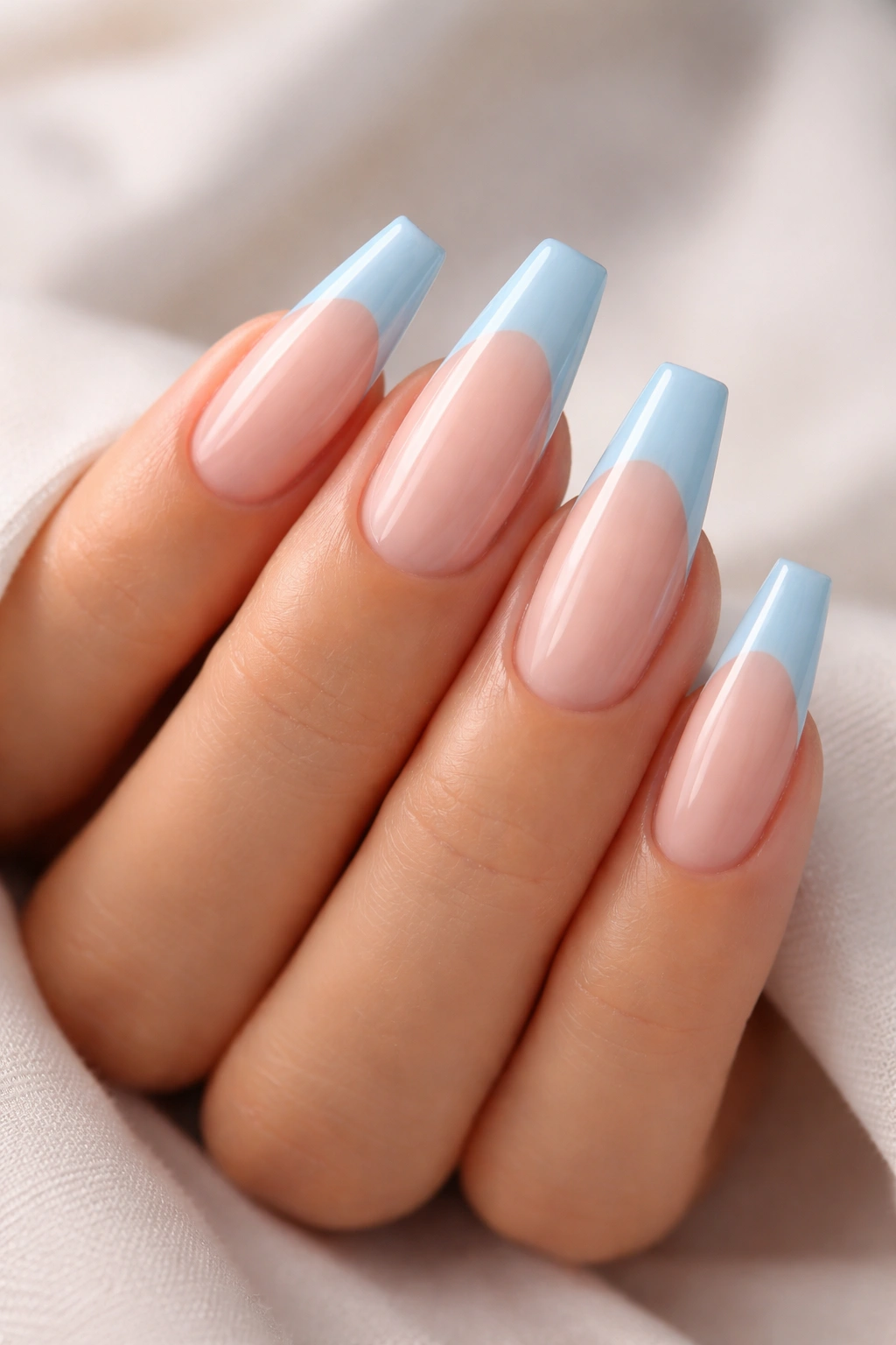 Coffin nails with sheer pink base and blue tips